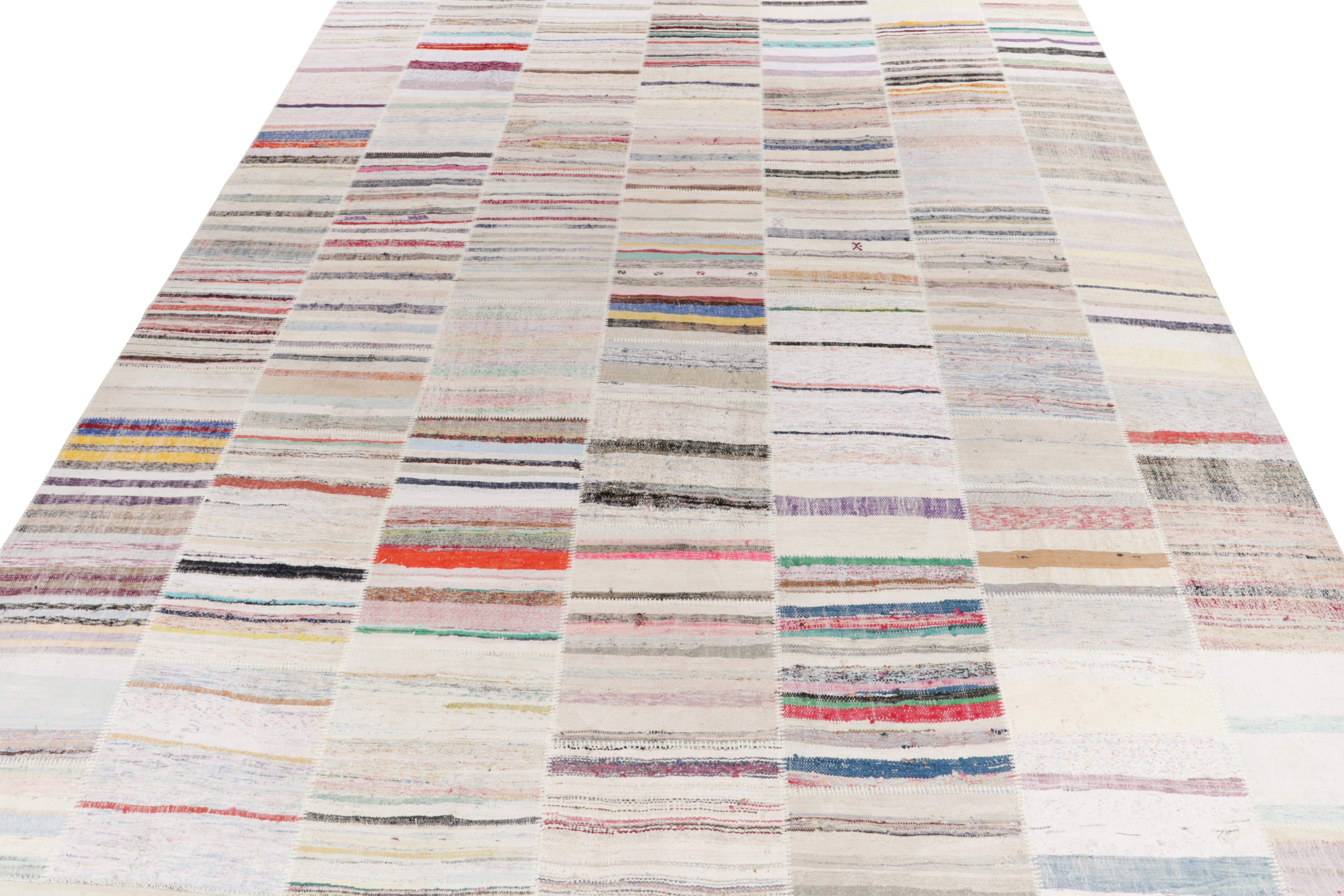 Rug & Kilim takes pride in presenting its artistic vision of patchwork kilim that reimagines vintage yarns into unique pieces of art. This 12x15 flatweave features a striated pattern that lends a smooth sense of movement in variegated shades across