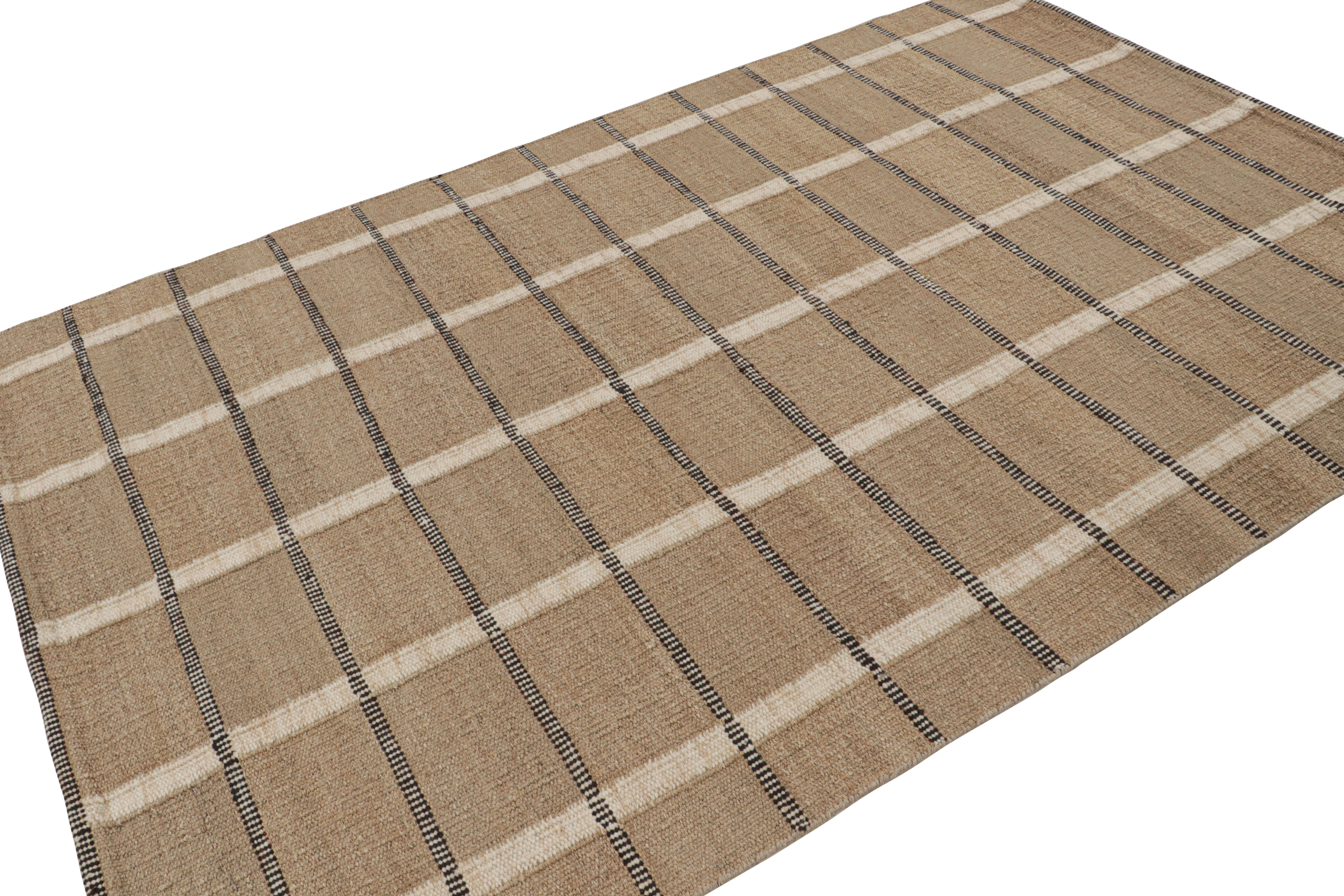 Handwoven in hemp, this 6x9 sustainable flatweave represents the “Natural” line of Rug & Kilim’s Scandinavian rug collection.

On the Design:

The design enjoys a field of beige-brown tones underscoring stripes in white and black, forming an all