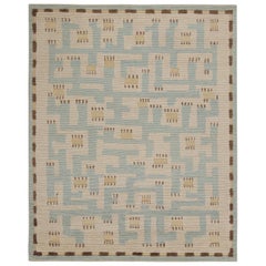 Rug & Kilim’s “High” Scandinavian Style Rug with Blue and Beige Geometric