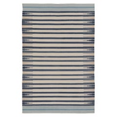Rug & Kilim’s Indian Dhurrie Rug in Navy and Cream with Geometric Borders