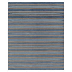 Rug & Kilim’s Indian Dhurrie Rug in Slate Blue and Ochre Stripes