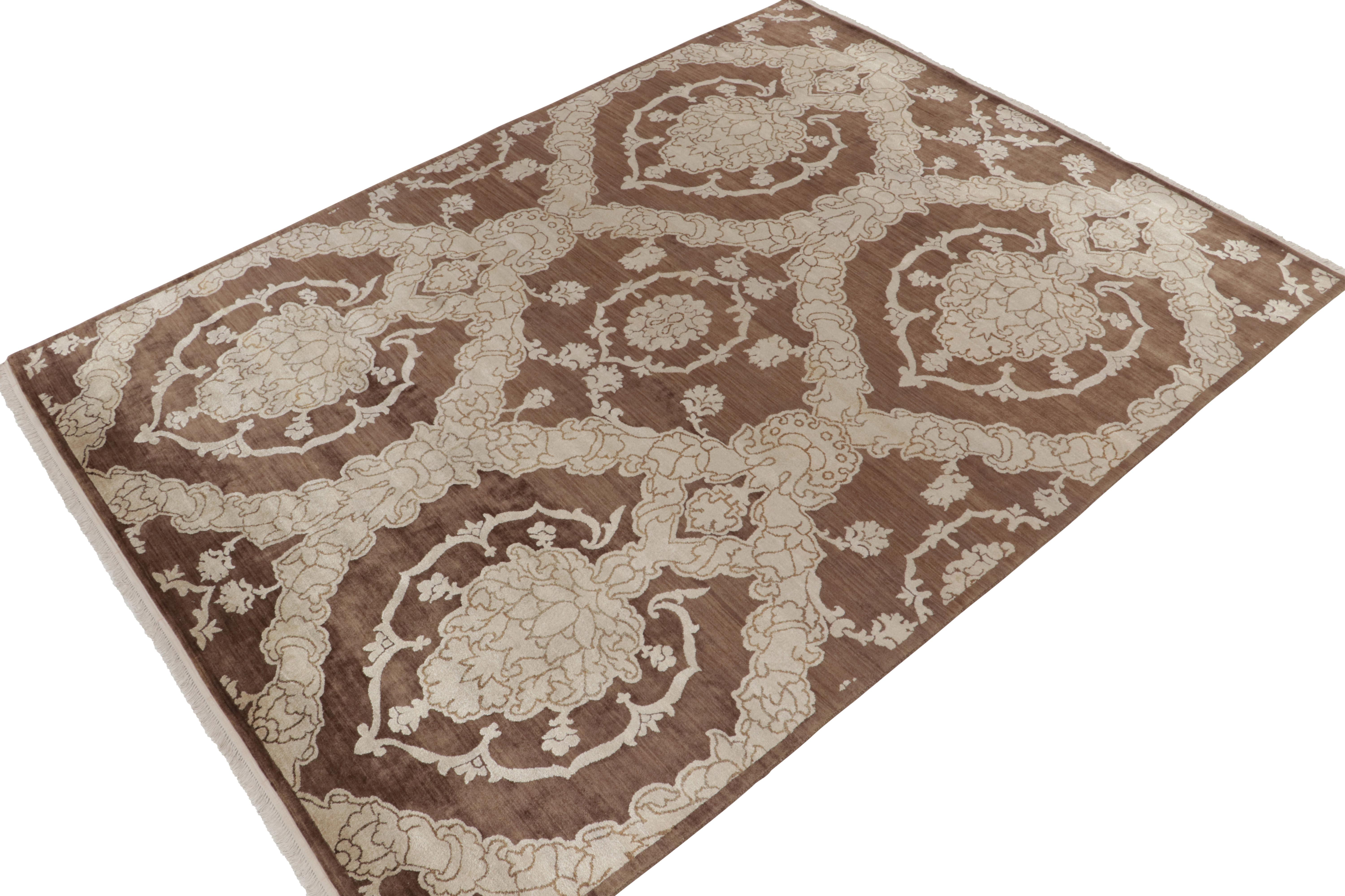 Hand-knotted in luxurious silk, this 9x12 contemporary rug from our Modern Classics collection draws on a delicious European sensibility. 

On the design: A gracious scale hosts a play of medallions and floral trellis patterns connoting