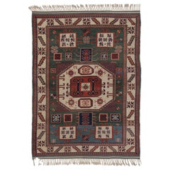 Rug & Kilim’s Kazak-Inspired Rug, Tribal Geometric Patterns in Green & Red