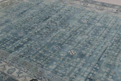 Rug & Kilim’s Khotan-Inspired Rug in Blue with Gray Floral Patterns and Borders