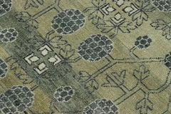 Rug & Kilim’s Khotan-Inspired Rug in Green with Pomegranate Floral Patterns