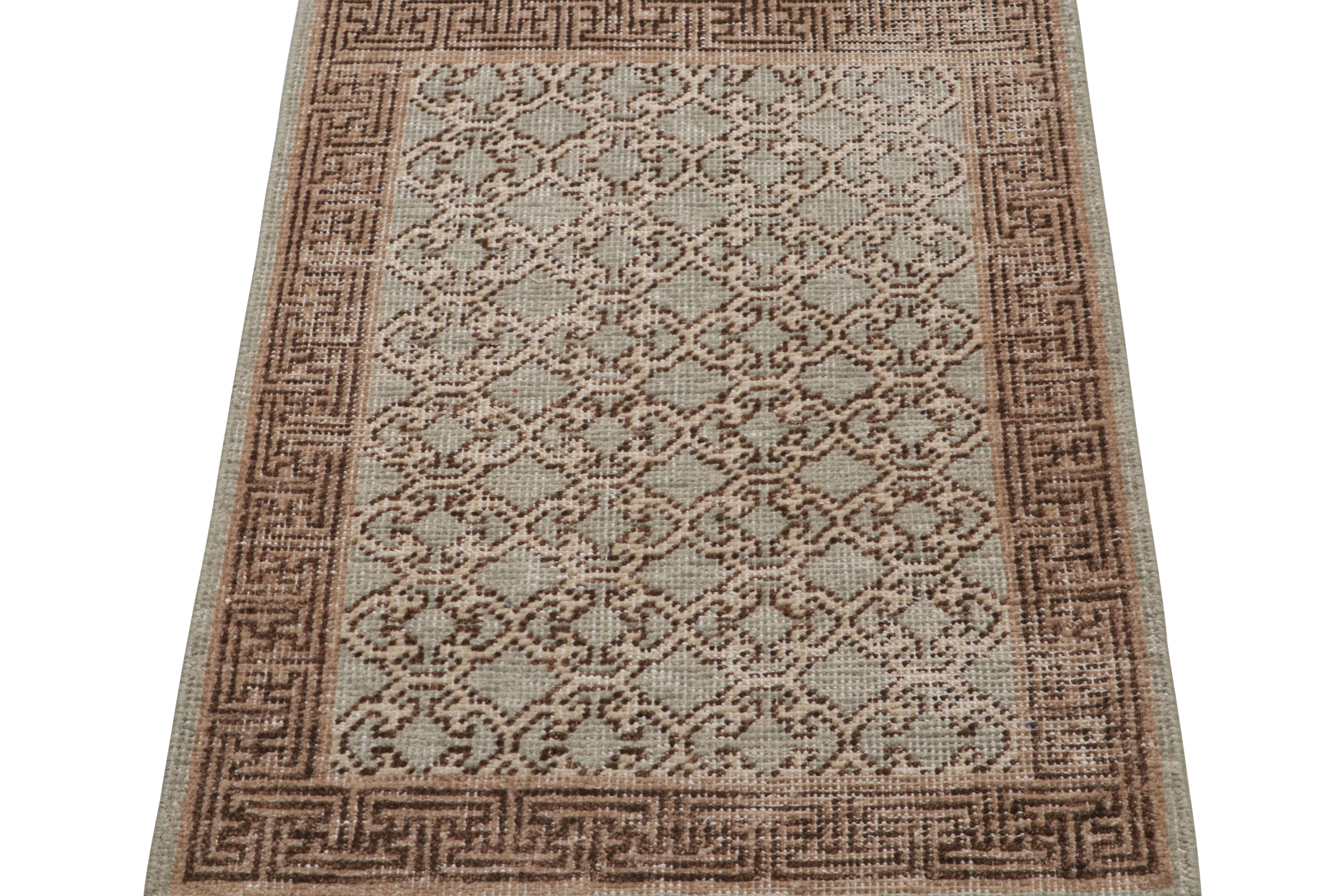 Hand-knotted in wool, this 2x3 rug from Rug & Kilim is inspired by Khotan Samarkand Rugs. 

On the Design: 

The pattern features light gray with a sage green accent underscoring geometric trellis patterns in beige-brown tones in the field, with