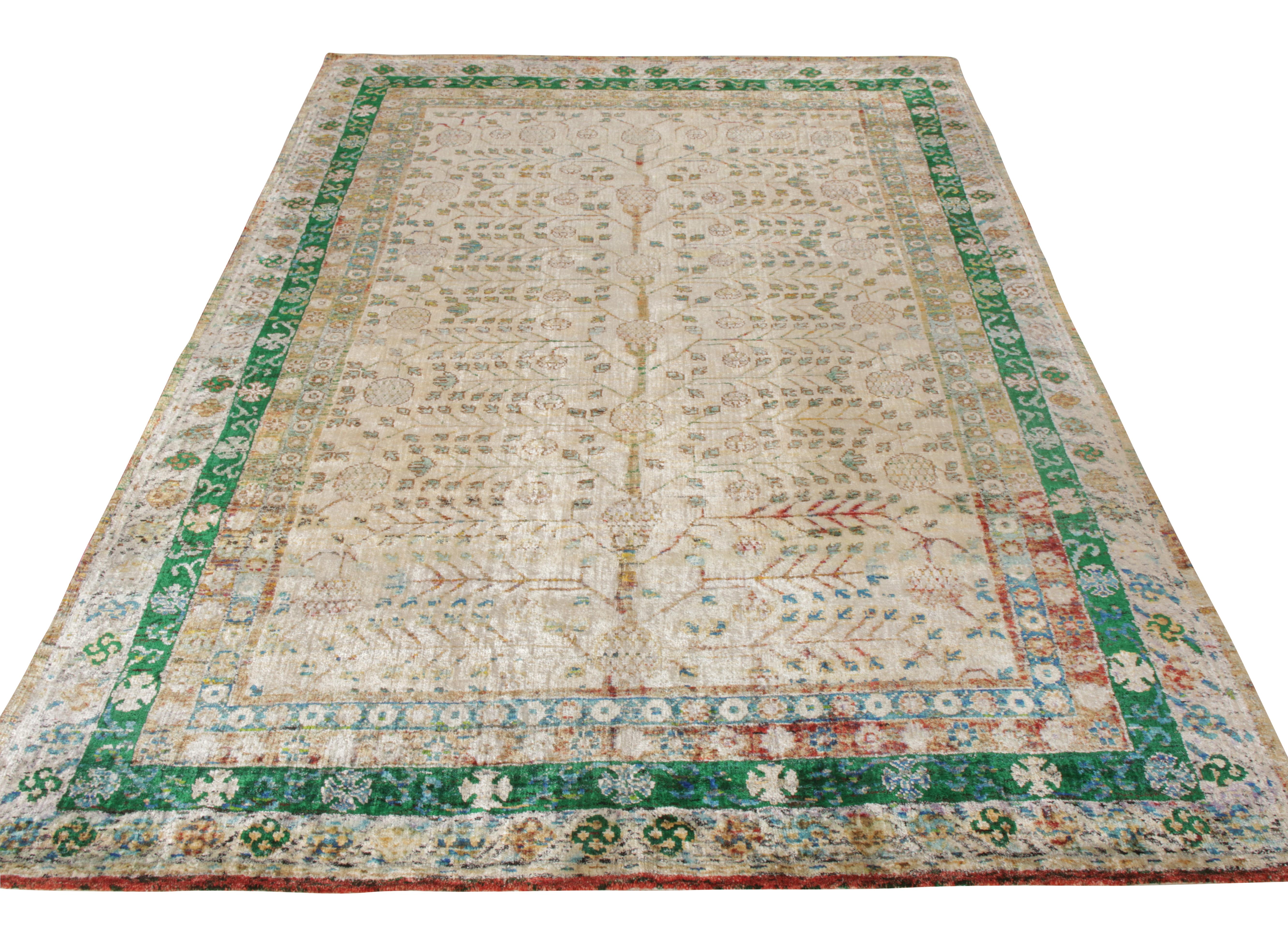 Inspired by the celebrated Khotan style, the 6x9 rug enjoys a signature pomegranate pattern prevailing in alluring shades of green on a luscious white background complemented by the natural sheen of silk. A hand-knotted piece by Rug & Kilim perfect