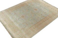 Rug & Kilim’s Khotan Style Rug with Blue, Gold and Green Floral Pattern