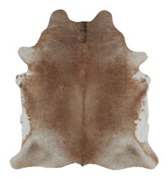 Rug & Kilim’s Large Cowhide Rug in Warm Beige and Brown Tones