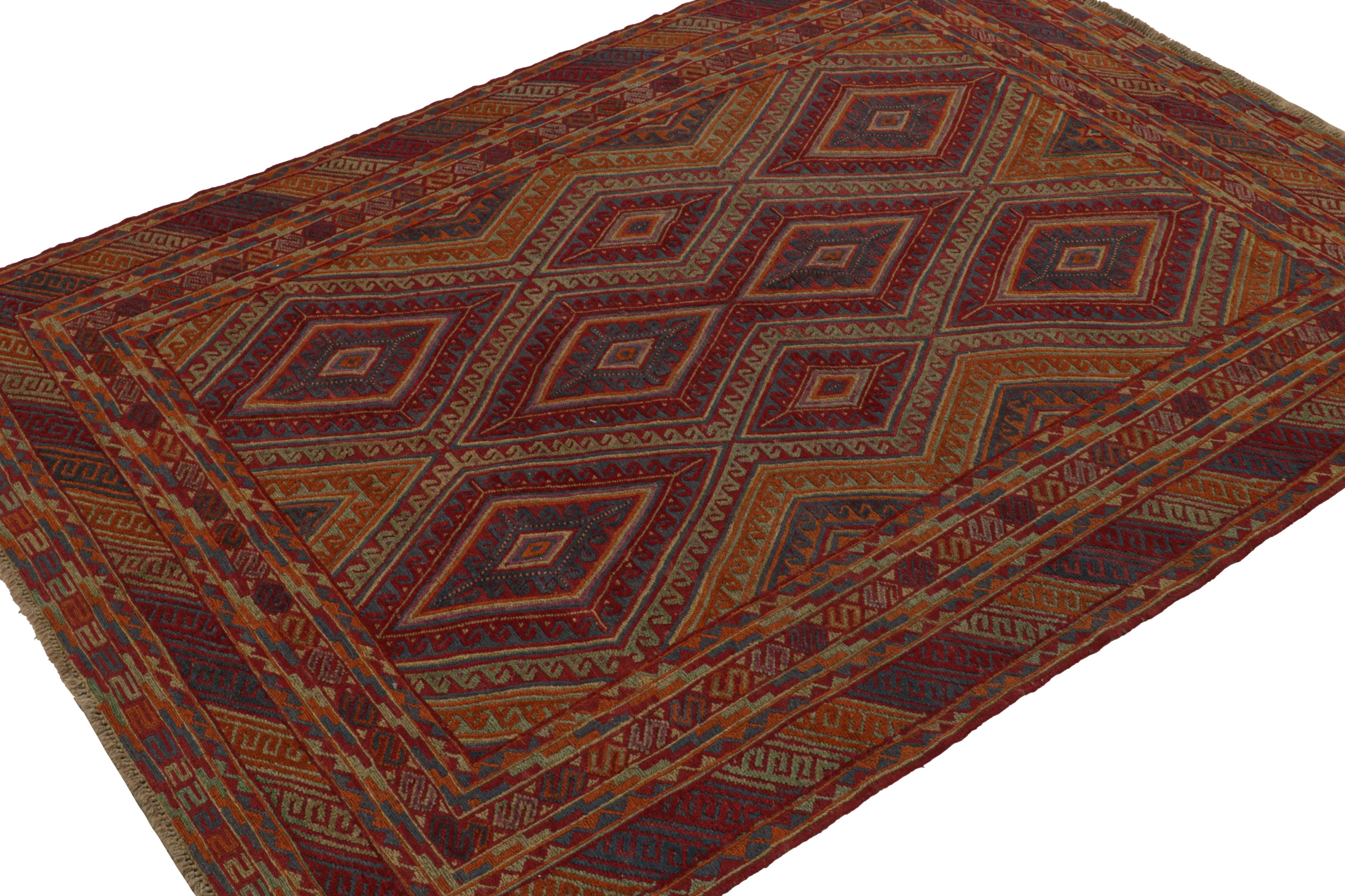 Hand knotted in wool, this 7x9 Baluch rug represents a new line of tribal carpets in the Modern Classics Collection by Rug & Kilim. Each piece  represents the work of women weavers in Afghanistan, preserving the rich tradition of their centuries-old