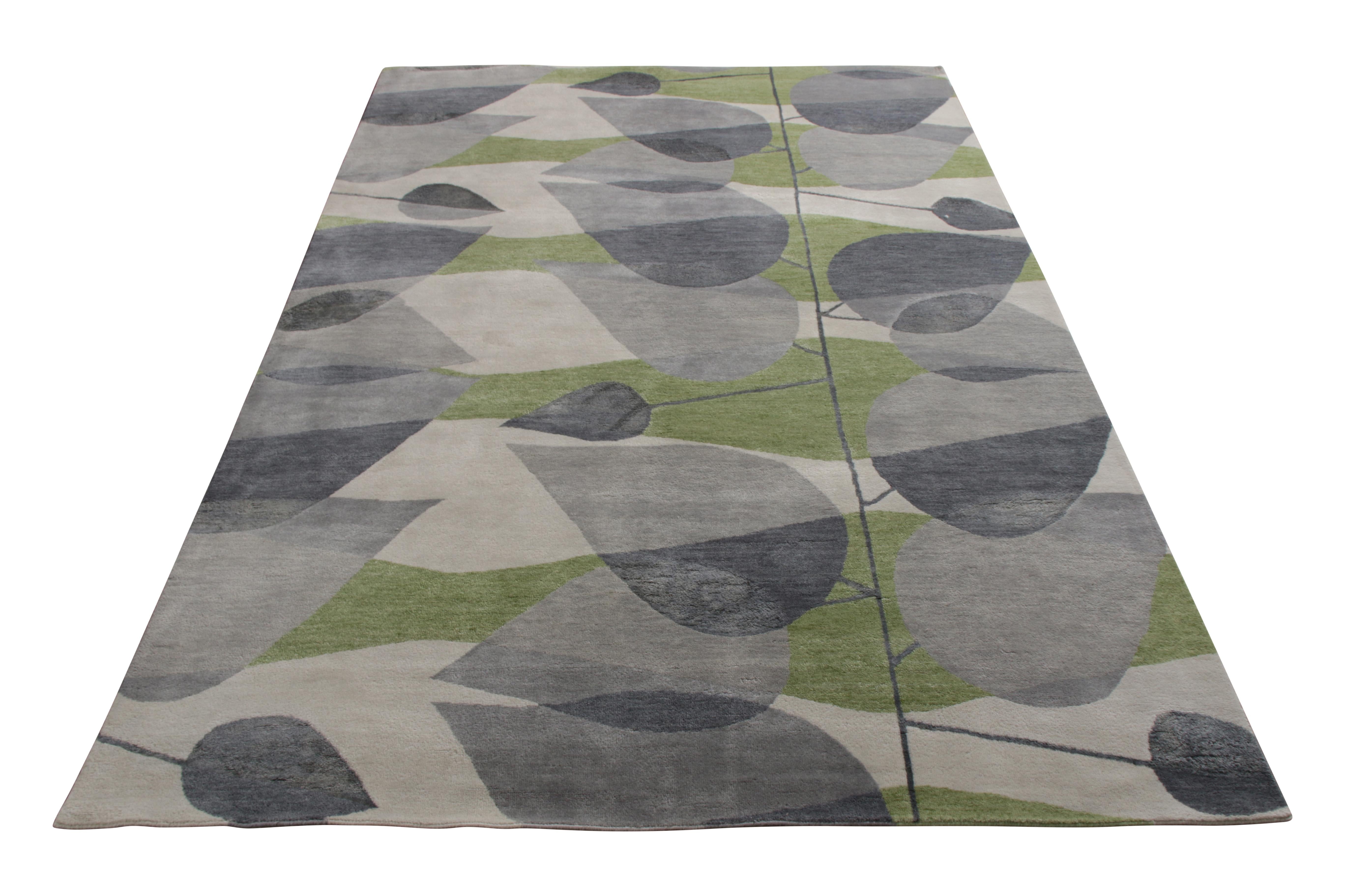 A 6 x 9 Mid-Century Modern rug from the titular collection by Rug & Kilim’s—a reimaging of bold 1950s style. Hand knotted in wool and silk, enjoying playful Deco sensibilities in chic silver-gray and green hues throughout the pattern. Particularly