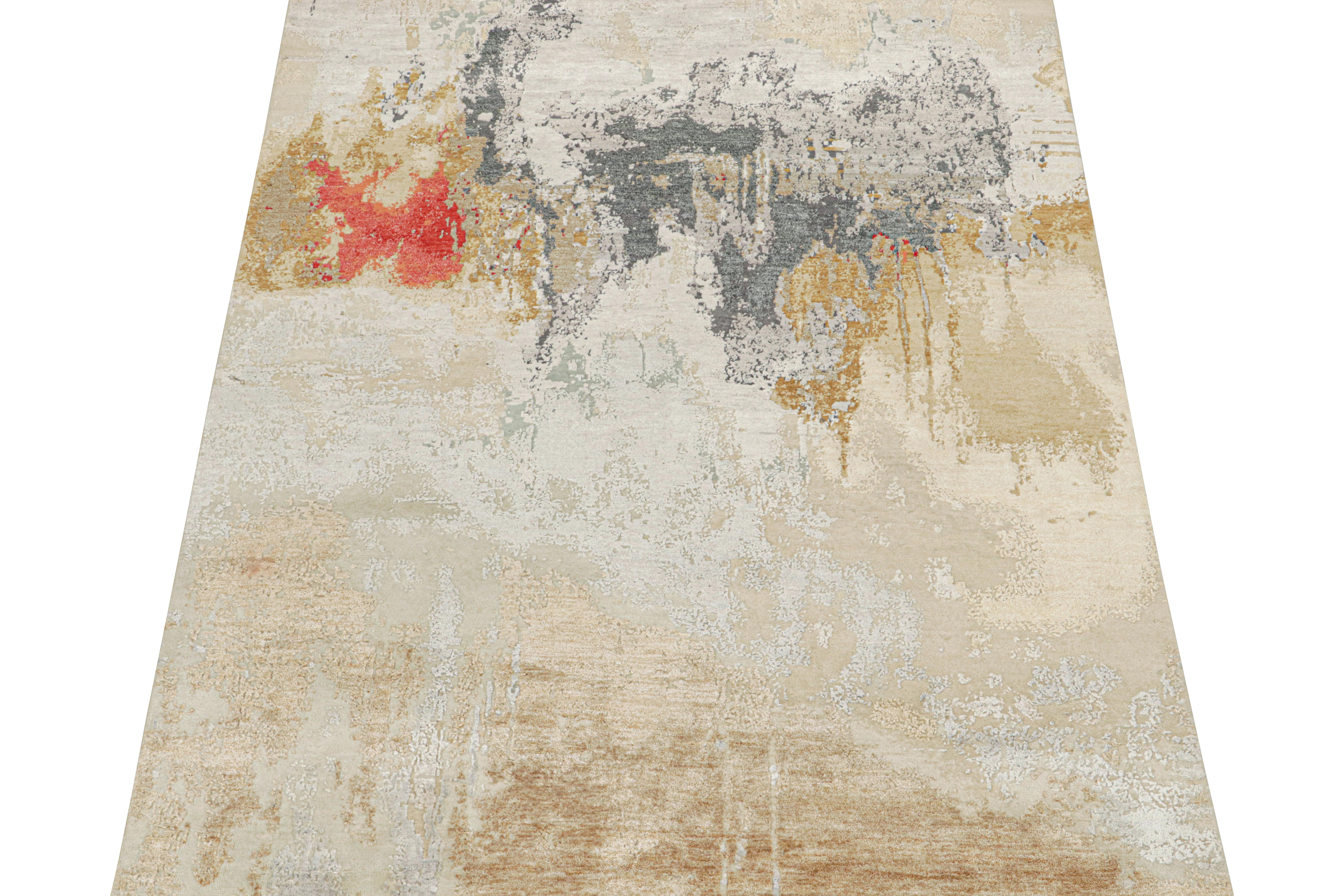 This 6x8 abstract rug is a new addition to Rug & Kilim’s contemporary rug collection. 

Hand-knotted in wool, cotton, and silk, its design enjoys a lively presence with splashes of beige-brown, gray, gold & red. Keen eyes will admire the silk’s