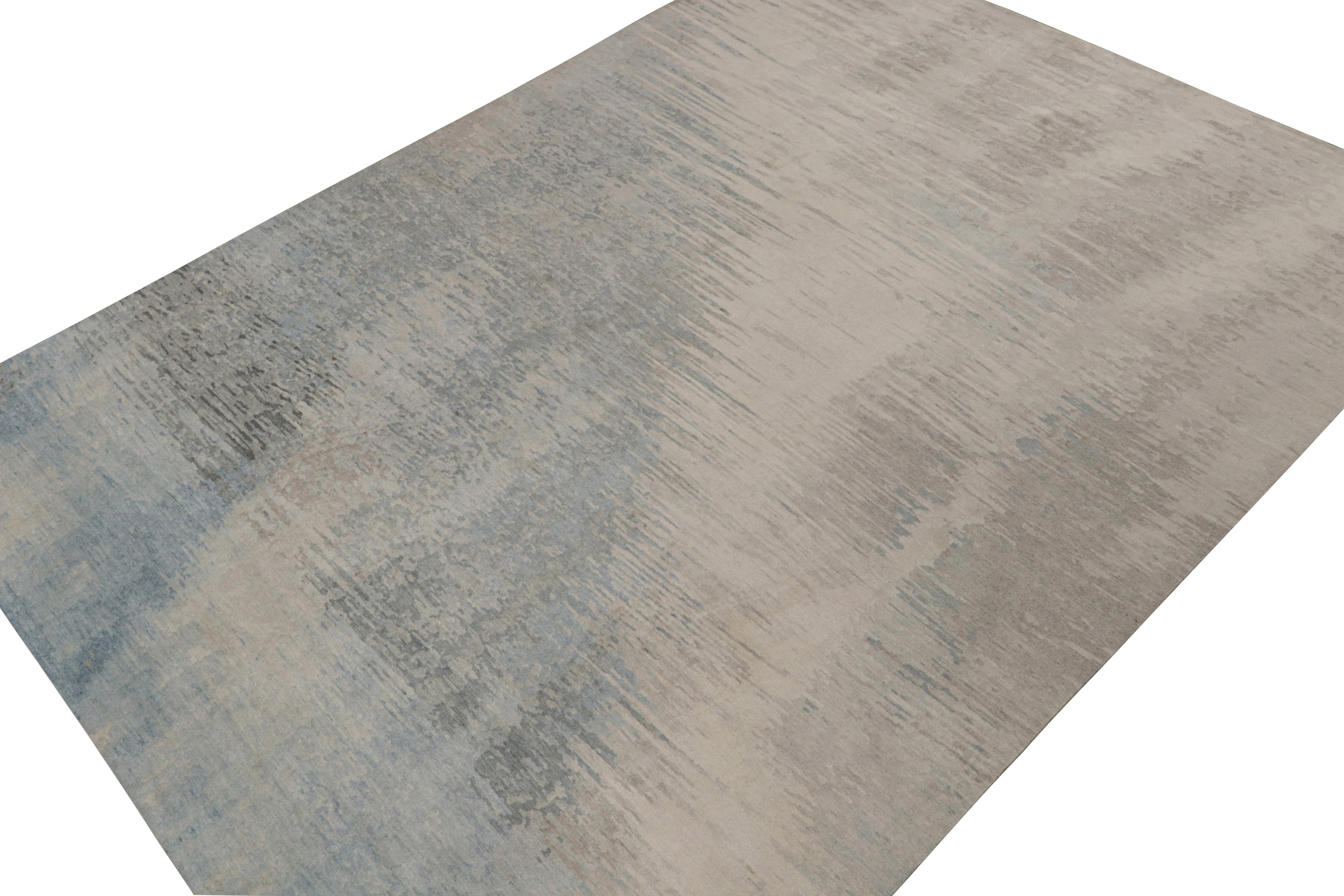 This contemporary 10x14 abstract rug is an exciting new entry in Rug & Kilim’s Modern Collection—hand-knotted in wool and silk. 

On the Design:

This abstract rug enjoys a smart play of cool tones and neutrals with a subtle look of depth to the