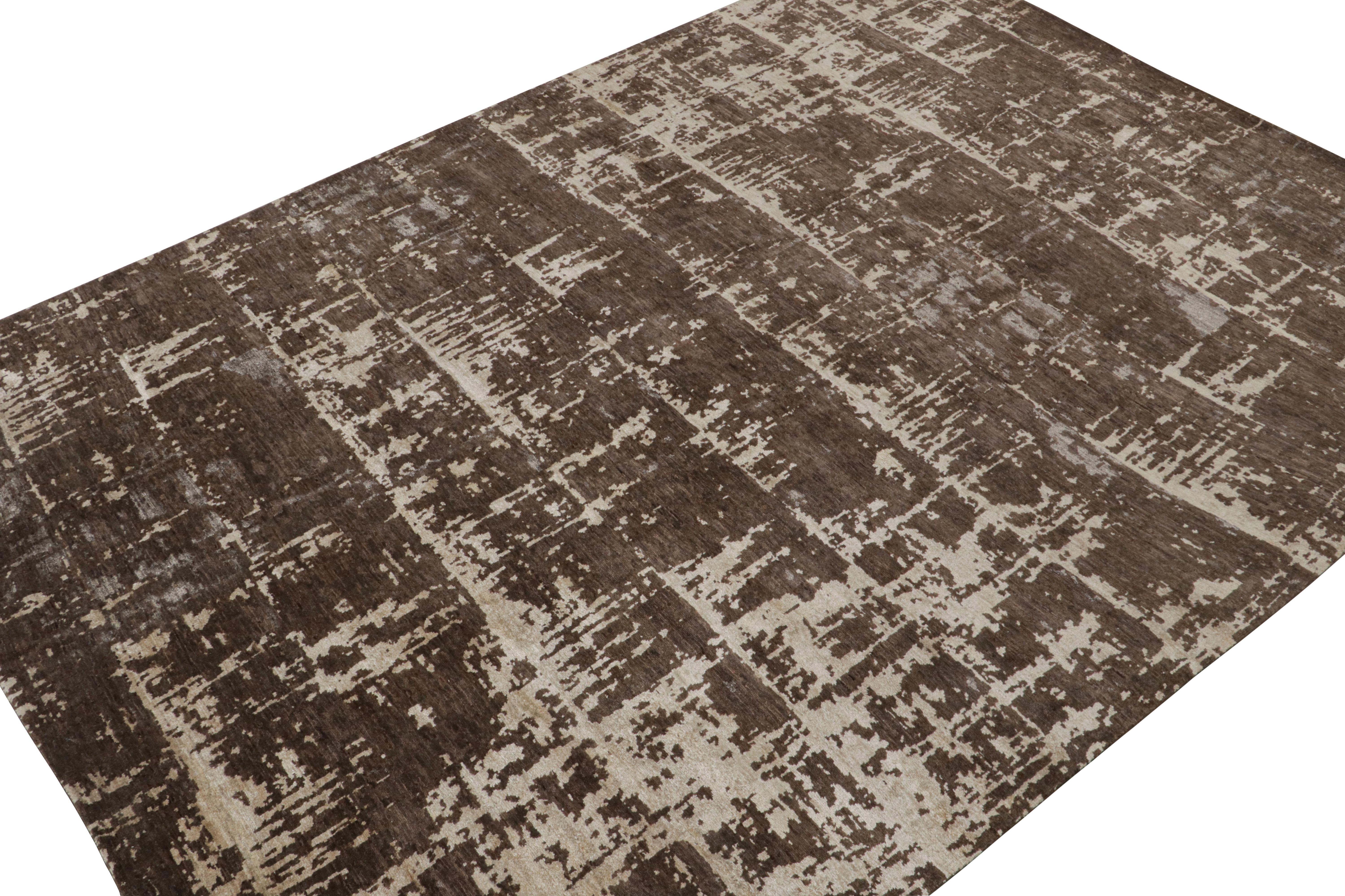 Hand-knotted in wool, silk and cotton, a 10x14 abstract rug from Rug & Kilim’s Modern collection.

On the Design: 

This rug enjoys a painterly, expressive pattern in rich brown, silver-gray and off-white tones. Connoisseurs will admire the bold