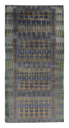 Rug & Kilim’s Modern Abstract Rug in Indigo, Purple, and Gold Geometry