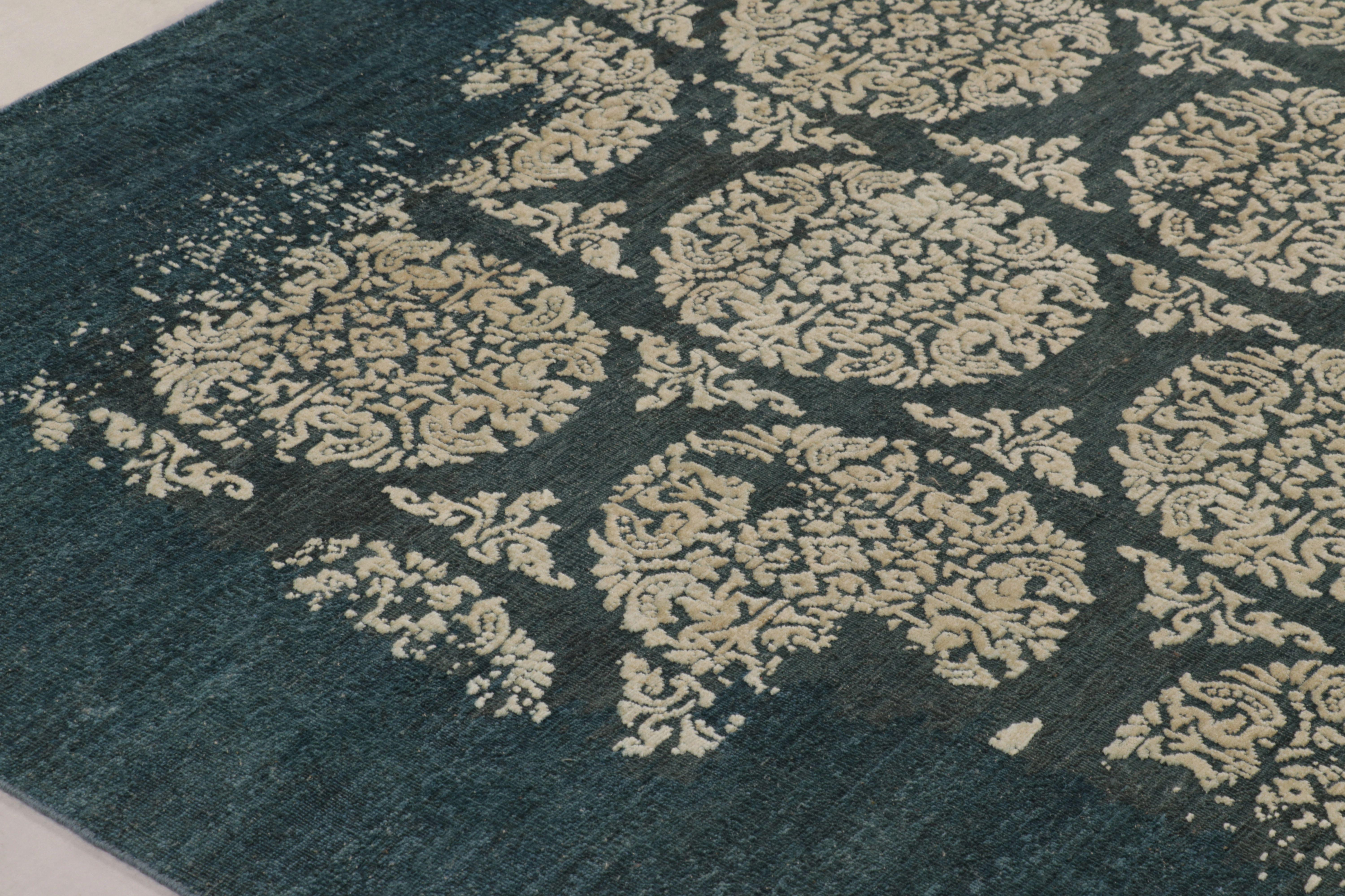 This dramatic 9x12 rug from the new line of the Modern Collection by Rug & Kilim is hand-knotted in a luxurious blend of wool and silk. It uses bold graphic contrast, featuring a repeating grid of intricate cream-colored circles that appear to be