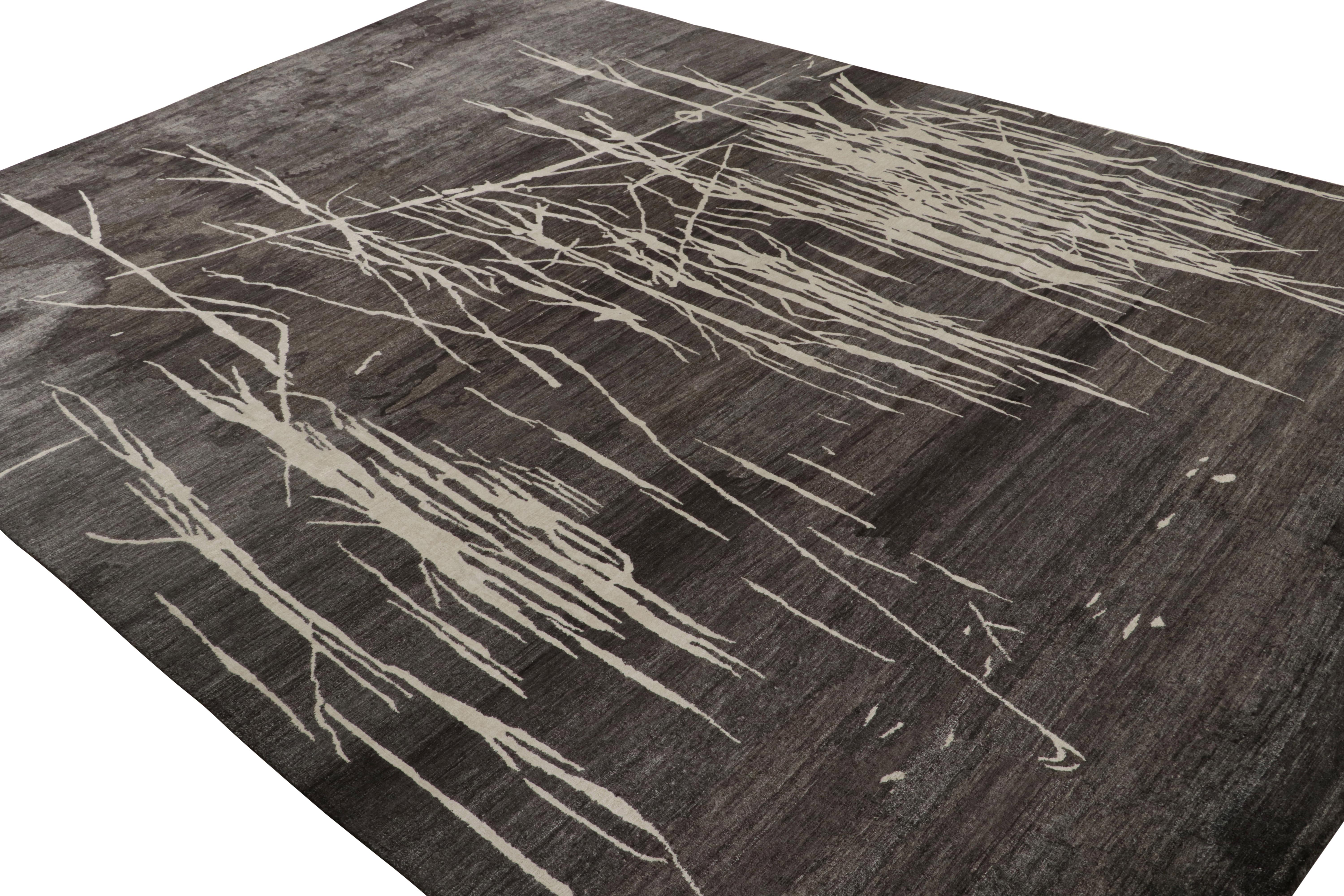 Hand-knotted in silk, this 9x12 abstract rug is a bold new addition to the Rug & Kilim Modern Collection. Its minimalist design enjoys a play of off-white geometric patterns on a lustrous black field with gray undertones.

On the Design: 

“Water