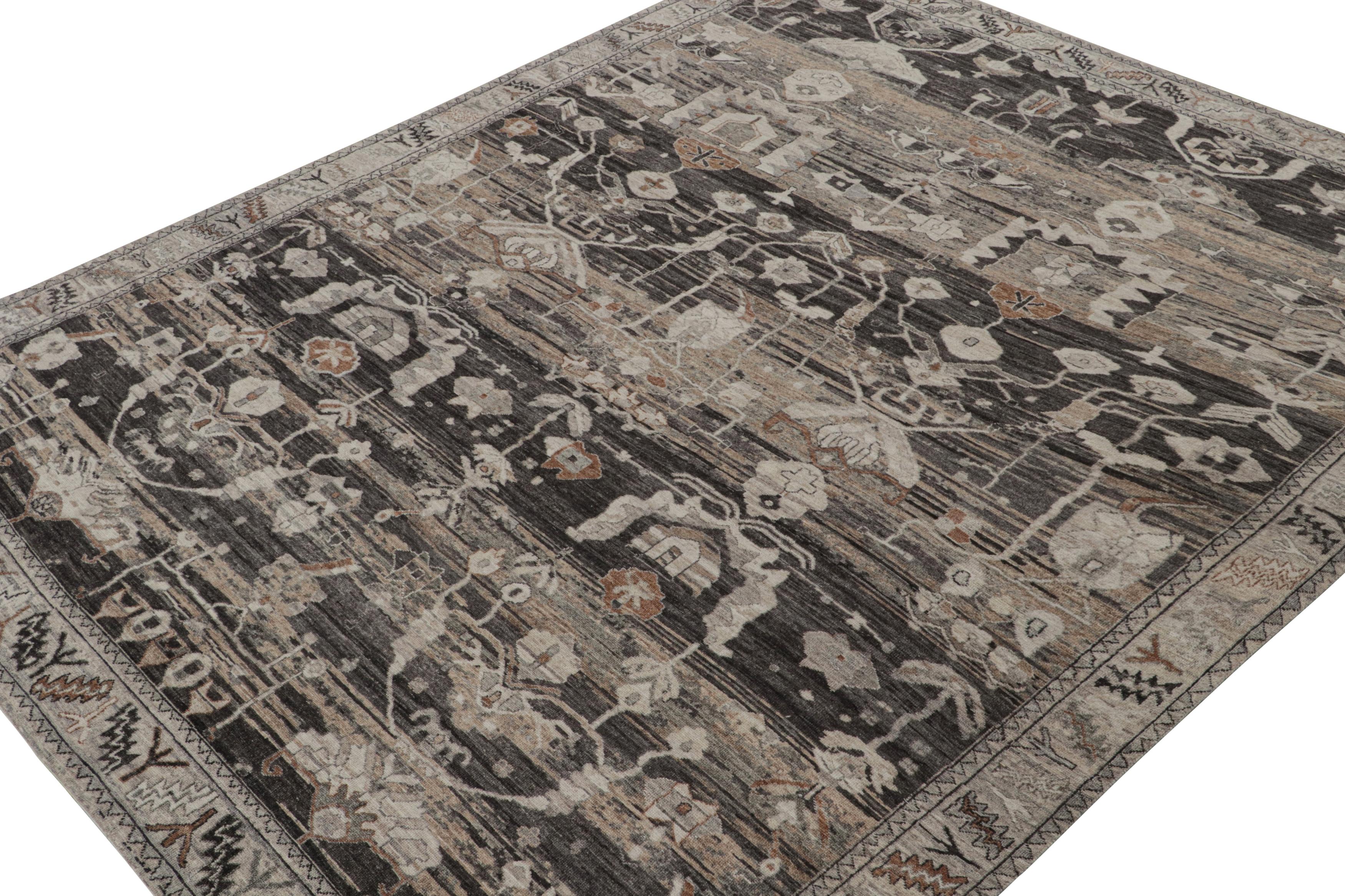 Dieser handgeknüpfte Teppich aus Wolle und Seide im Format 9x12 ist eine Neuheit aus der Modern Classics Collection'S von Rug & Kilim. Das Design mit geometrischen Blumenmustern und kräftigen Industrietönen ist eine subversive Neuinterpretation der