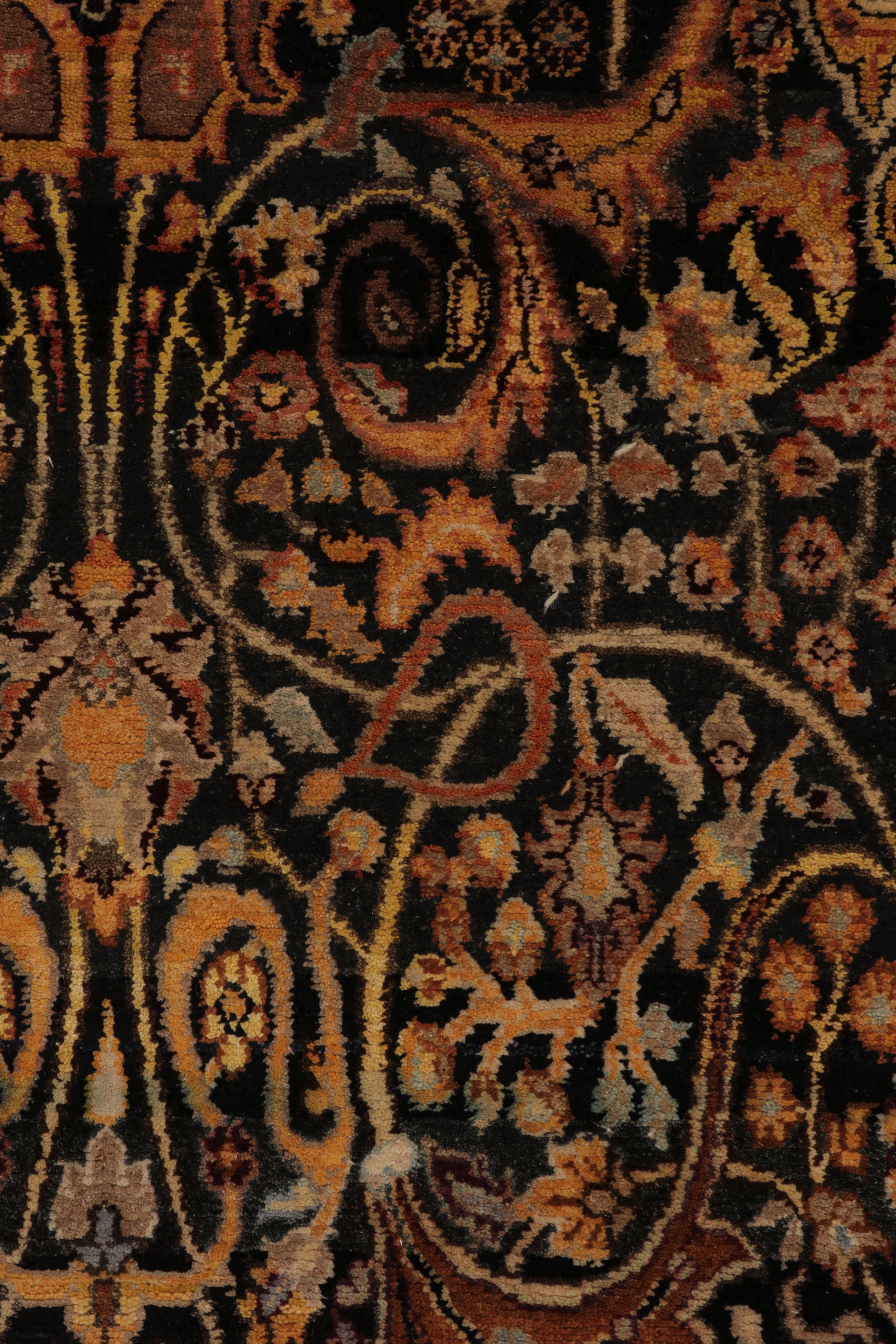 Hand-knotted in a luxurious blend of wool, linen and luminous silk, this captivating 8x10 rug is a magnificent study in intricate density and jewel-toned richness. The field features a complex, all-over boteh and paisley pattern on a dramatic black