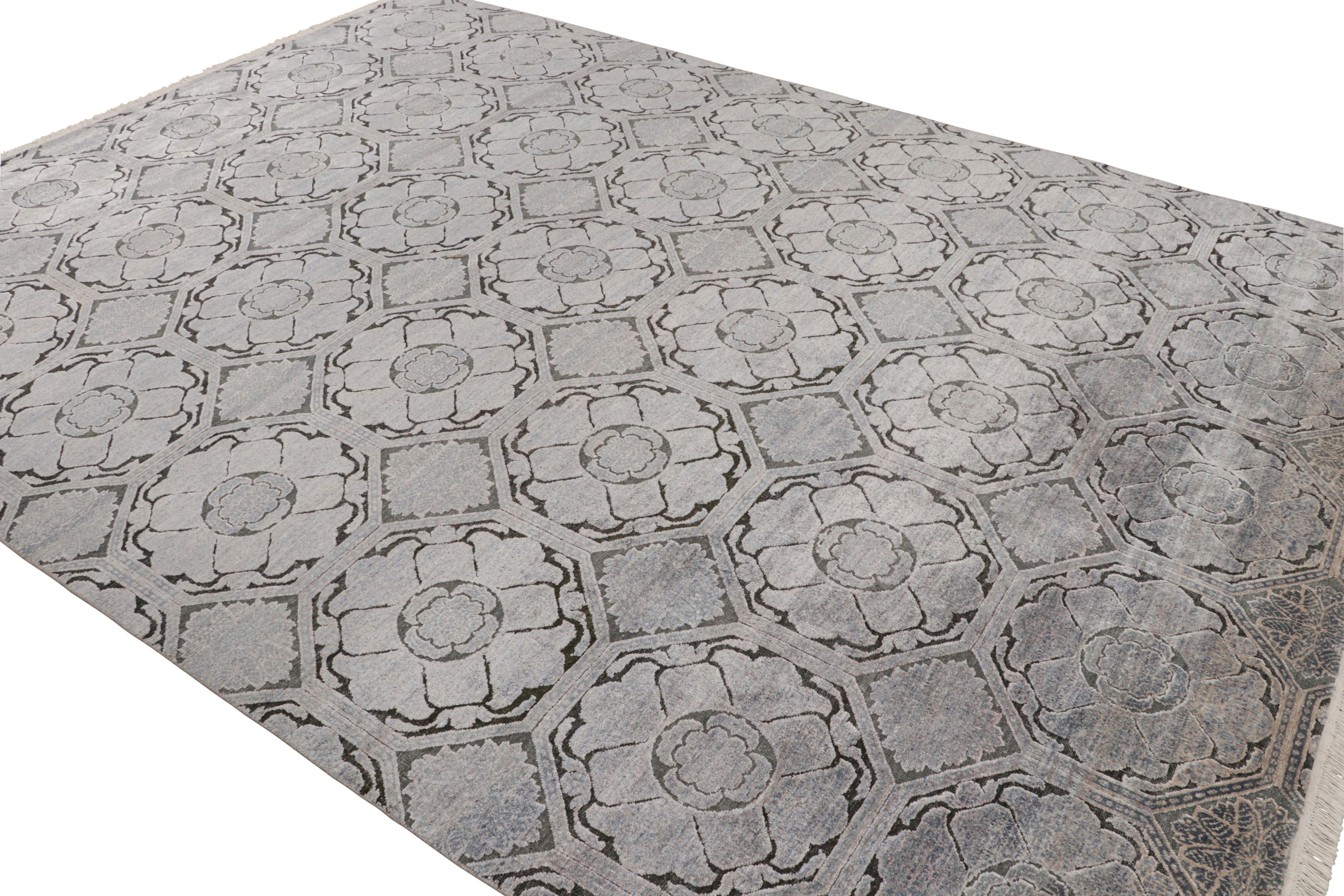 A 9×12 rug inspired from traditional rug styles, from Rug & Kilim’s Modern Classics Collection. Hand-knotted in silk, playing silver-gray, blue and black floral patterns with a new twist on classic grace.

Further On the Design:

The play of gray,