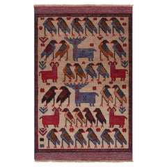 Alfombra tribal Modern Classics de Rug & Kilim en beige con dibujos de animales
