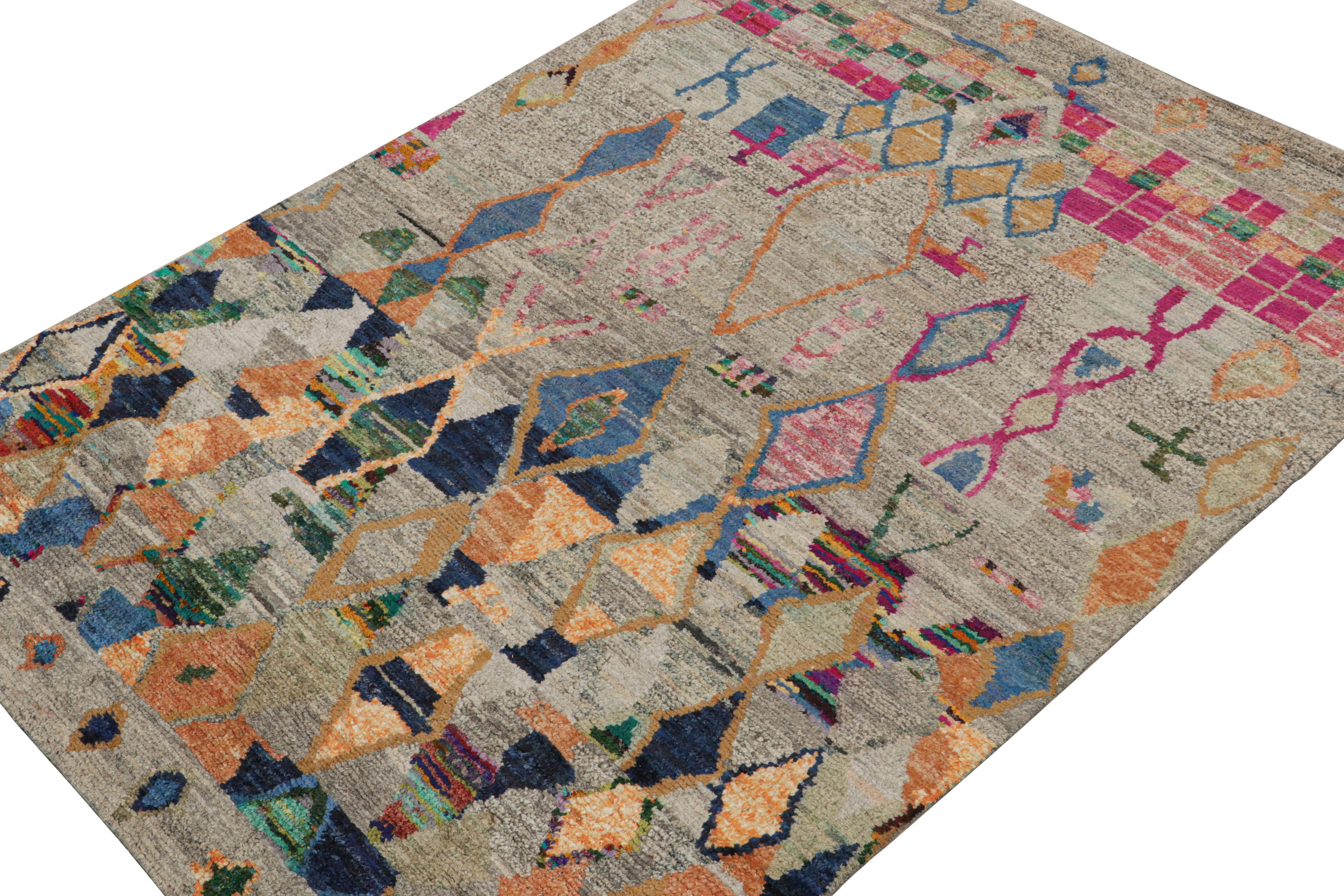 Hand-knotted in wool, silk & cotton, this 6x8 custom rug is a new addition to the Moroccan Collection by Rug & Kilim. 

On the Design

This rug enjoys primitivist style with patterns in tones of gray, blue, pink & gold. Connoisseurs will admire this