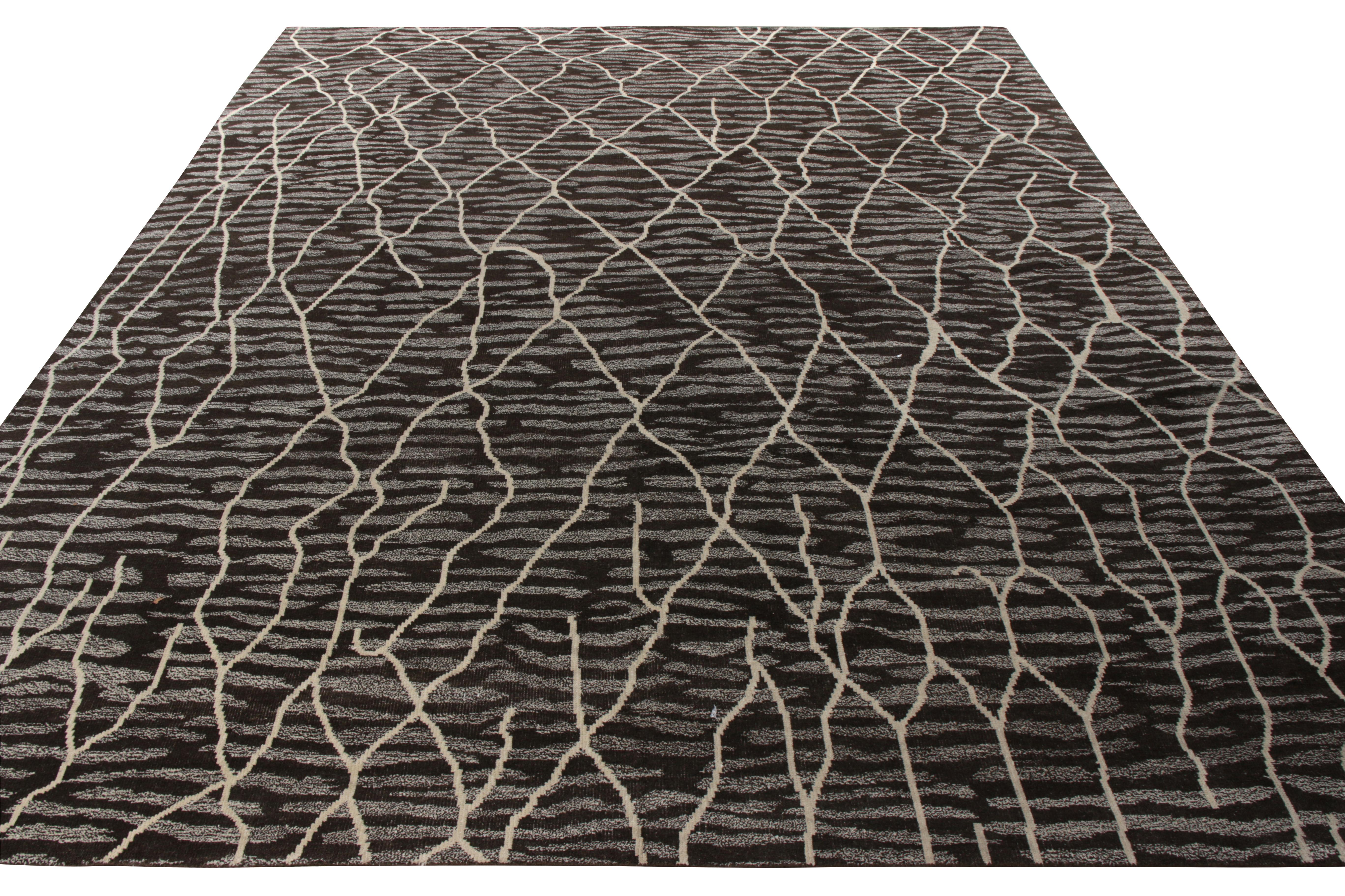 A 12x15 example of a hand-knotted custom piece available from Rug & Kilim’s New & Modern Collection. This ambitious drawing dons a modern vibe with an amalgam of geometric patterns and a repetitive striation playing intriguingly with the trellis