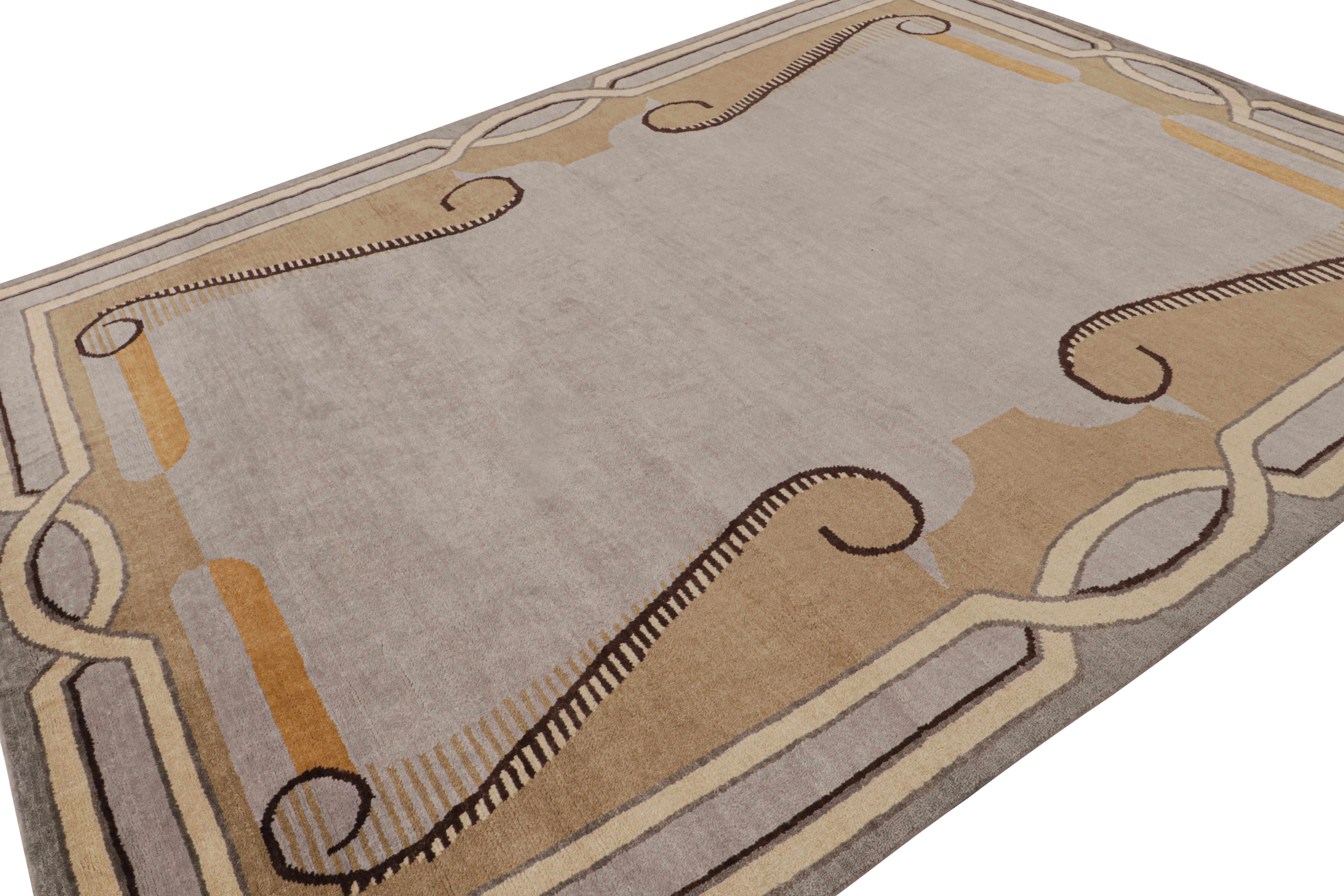 Hand-knotted in wool, this 9x12 modern rug by Rug & Kilim is a new addition to their French Art Deco rug line. Its design enjoys a gray open field with the most subtle hint of lavender tones underscoring architectural European-style borders in beige
