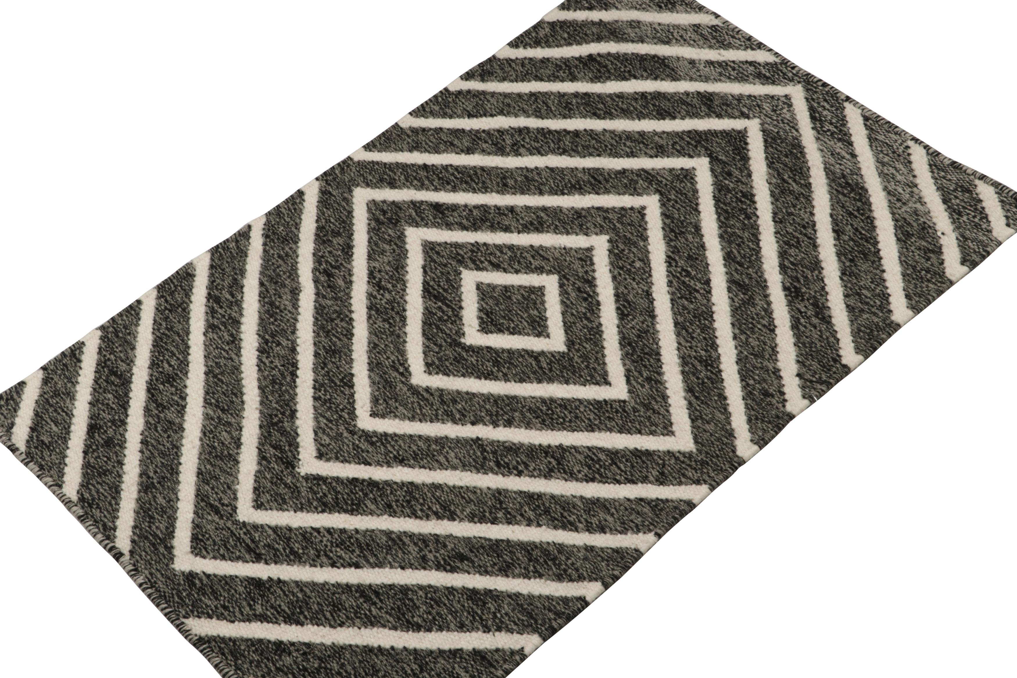 This 2x3 Kilim and accent rug is a new addition to the modern flatweave collection by Rug & Kilim. 
 
On the Design: 

Handwoven in wool, this contemporary enjoys white diamond patterns on charcoal gray and black with a salt-and-pepper striae. Its
