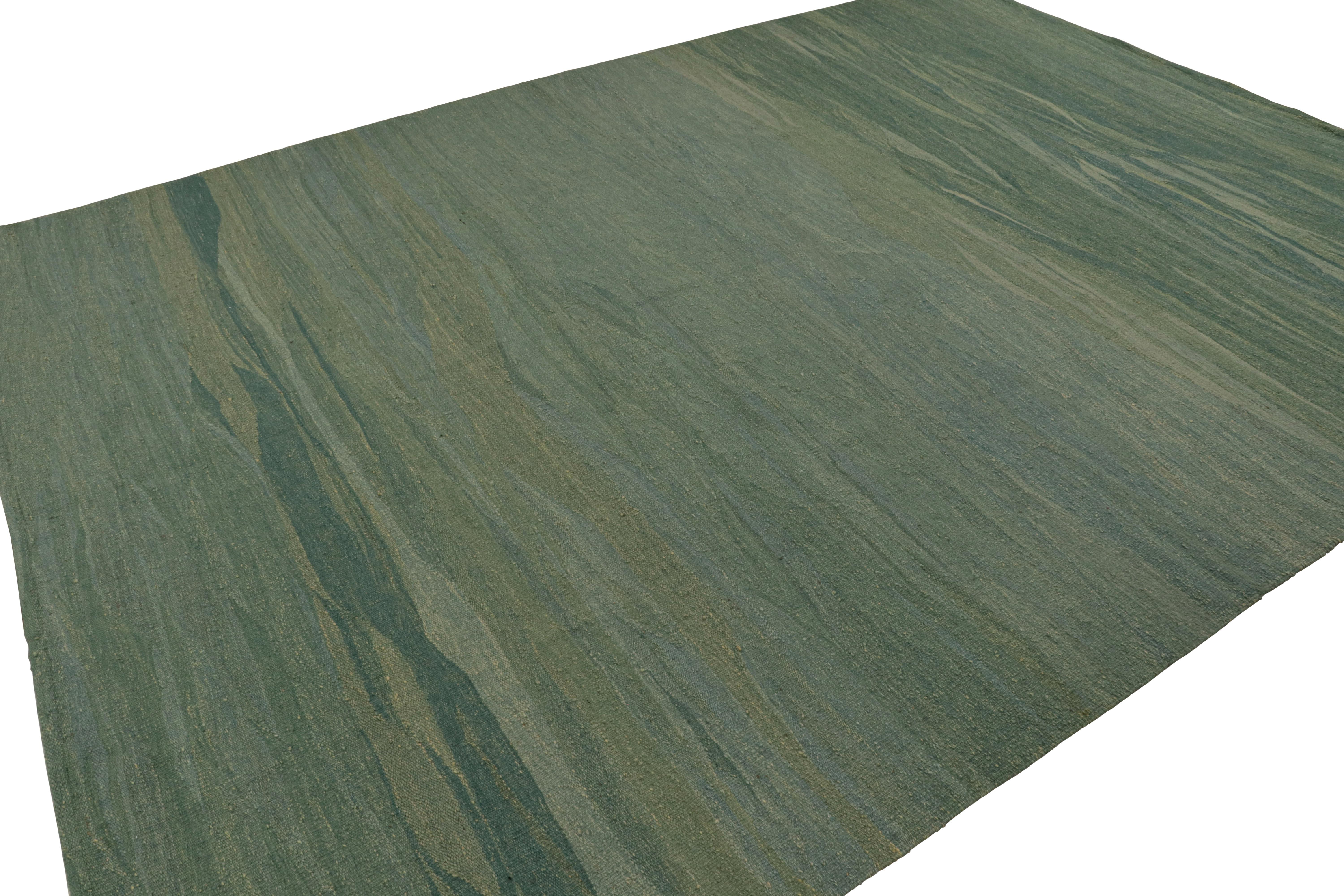 Noué à la main en laine, ce tapis kilim moderne 9x12 de style paddle-weave, en sarcelle, présente une géométrie subtile dans un motif sourd et sans motif. 

Sur le design : 

Tissé à la main en laine, ce tapis kilim moderne 9x12 de style