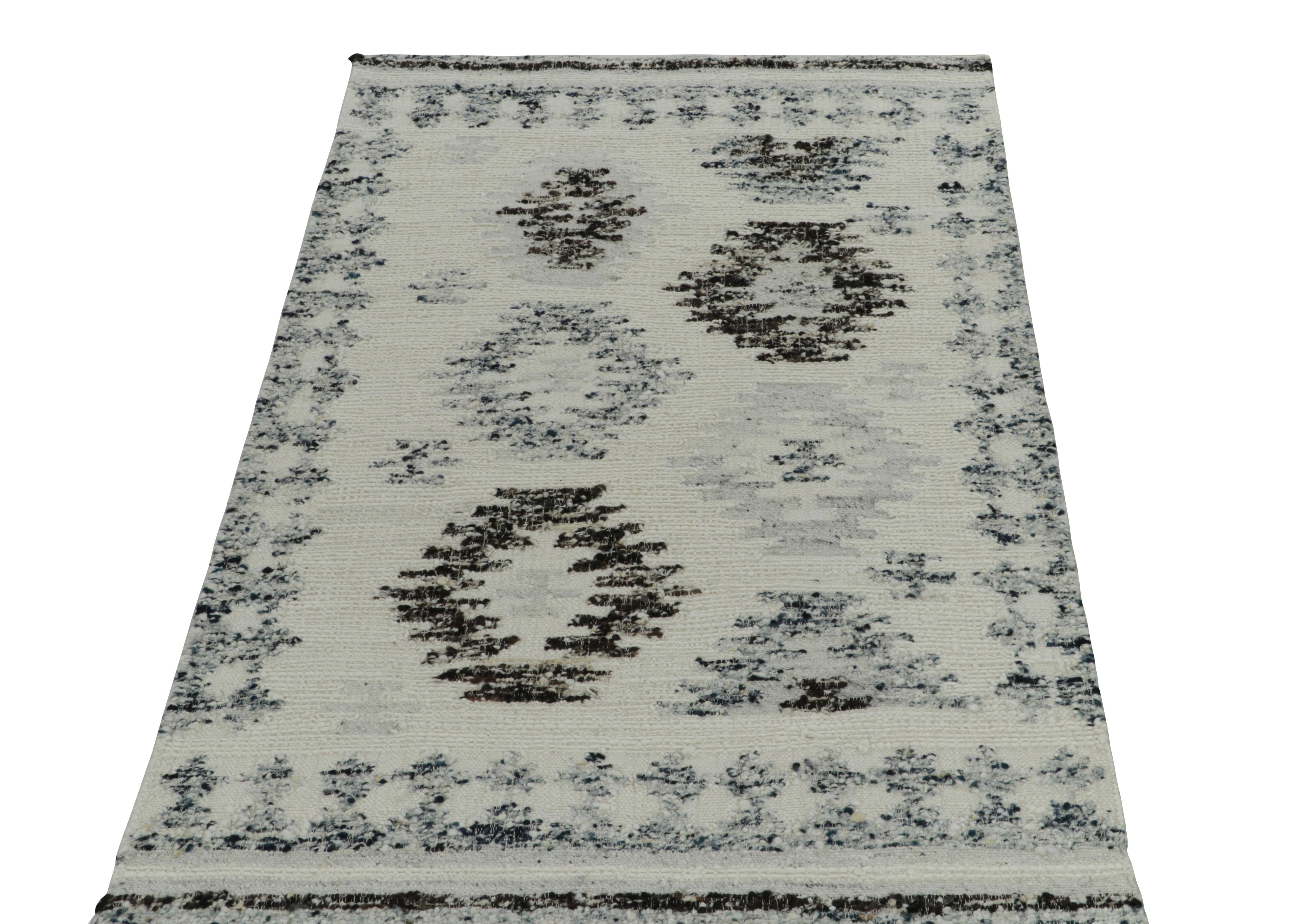 Rug & Kilim unveils an innovative 5x8 flat weave rug, exploring a bold play of classic geometry and modern texture. The Kilim rug enjoys an intriguing abstraction of tribal geometric patterns in crisp white, brown & cool blue. Furthermore the