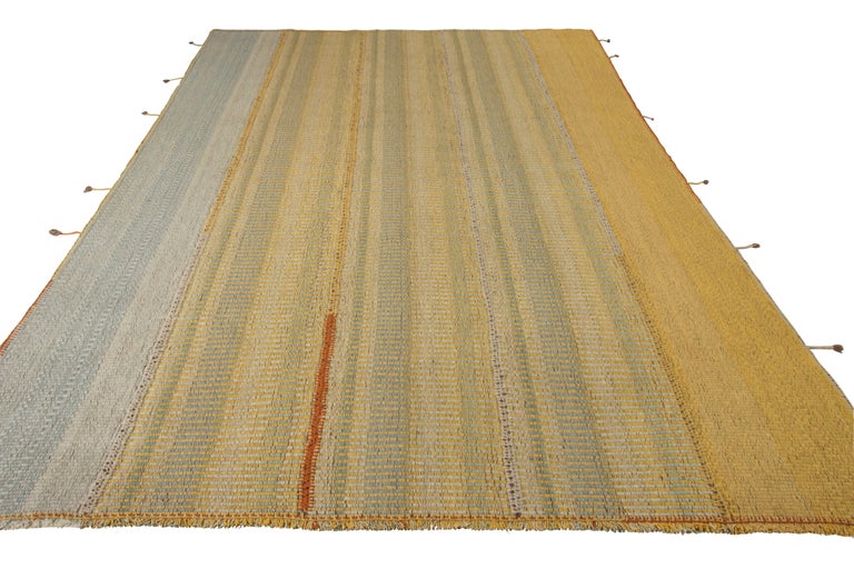 Rug & Kilim takes pride in introducing its new line of kilims that plays with texture for a fabulous textural look. Flatwoven in panels for added allure and depth, this 9x12 Kilim features a rare marriage of technique and with a balanced yellow and