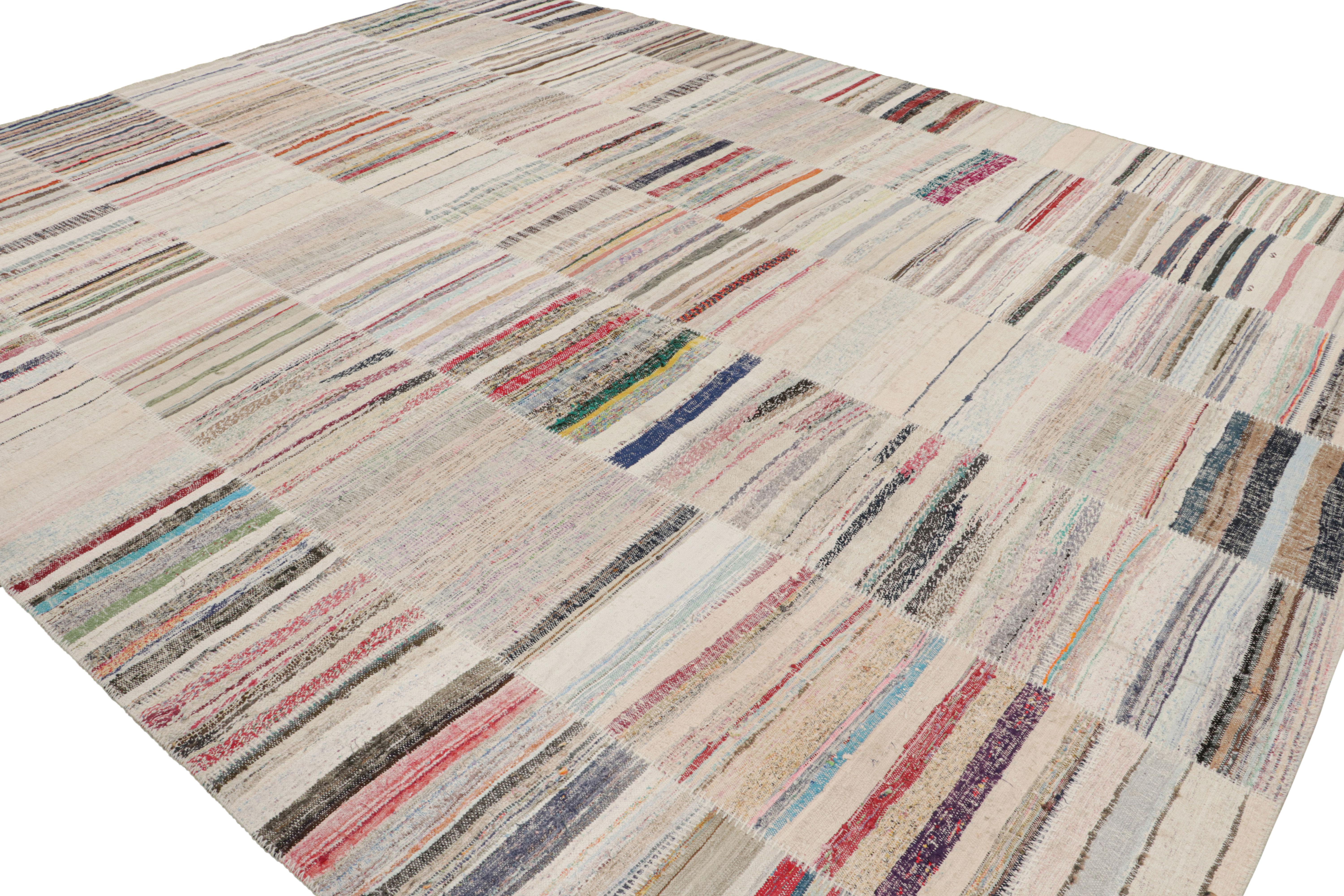 Handwoven in a wool flat-weave utilizing vintage yarns, this modern Kilim rug from Rug & Kilim’s Patchwork Kilim rug collection marries inspiration from midcentury Kilim rugs with a whimsical spectrum of red, blue, pink, green, and other colorways