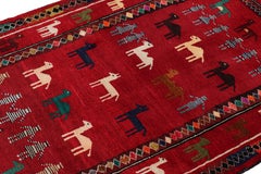 Rug & Kilim’s Modern Persian Gabbeh Rug in Red with Animal Pictorials