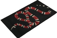 Rug & Kilim’s Modern Pictorial Rug in Black with Red & White Snake Design