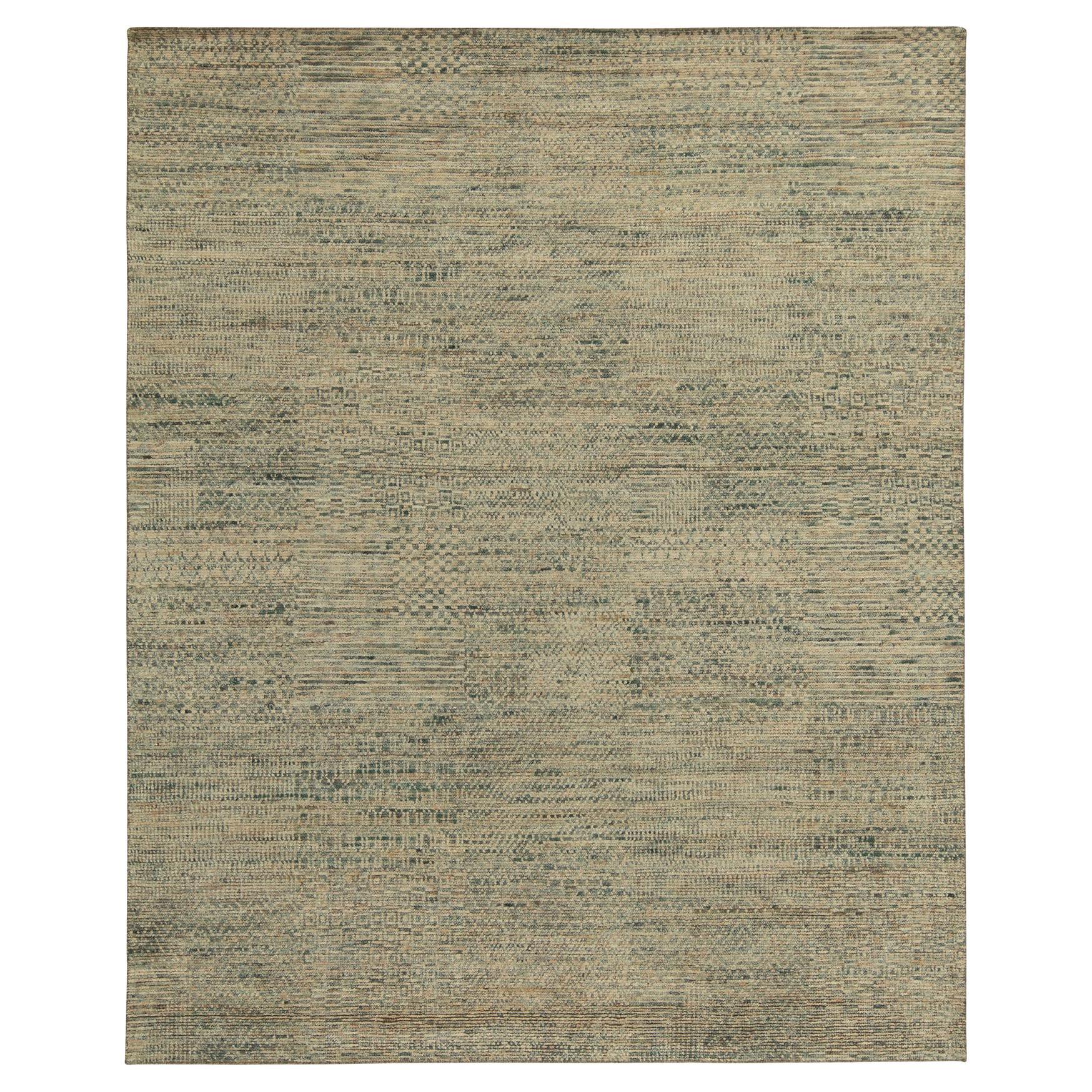 Hand-knotted in luxurious quality silk, a bold 8 x 10 contemporary rug with exceptional textural element and visual depth. This particular modern design displays a series of squared delegations of patterns united by the striae of beige and blue
