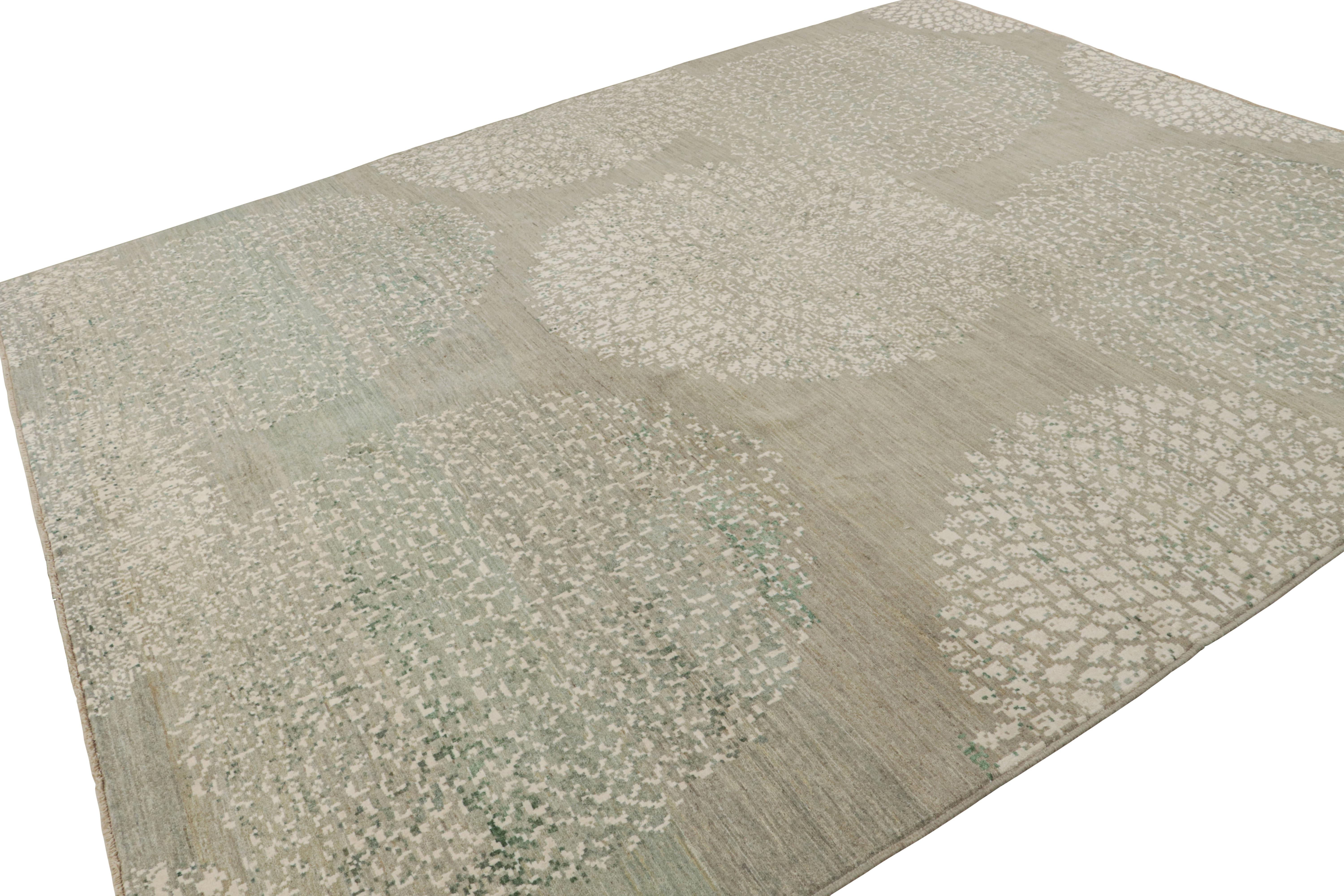 Hand-knotted in cotton and silk, this 9x12 modern rug explores a take on minimalist designs and subtlety, enjoying beige and gray undertones with off-white and green striae and geometric patterns.  

On the design: 

An exciting curation in the Rug