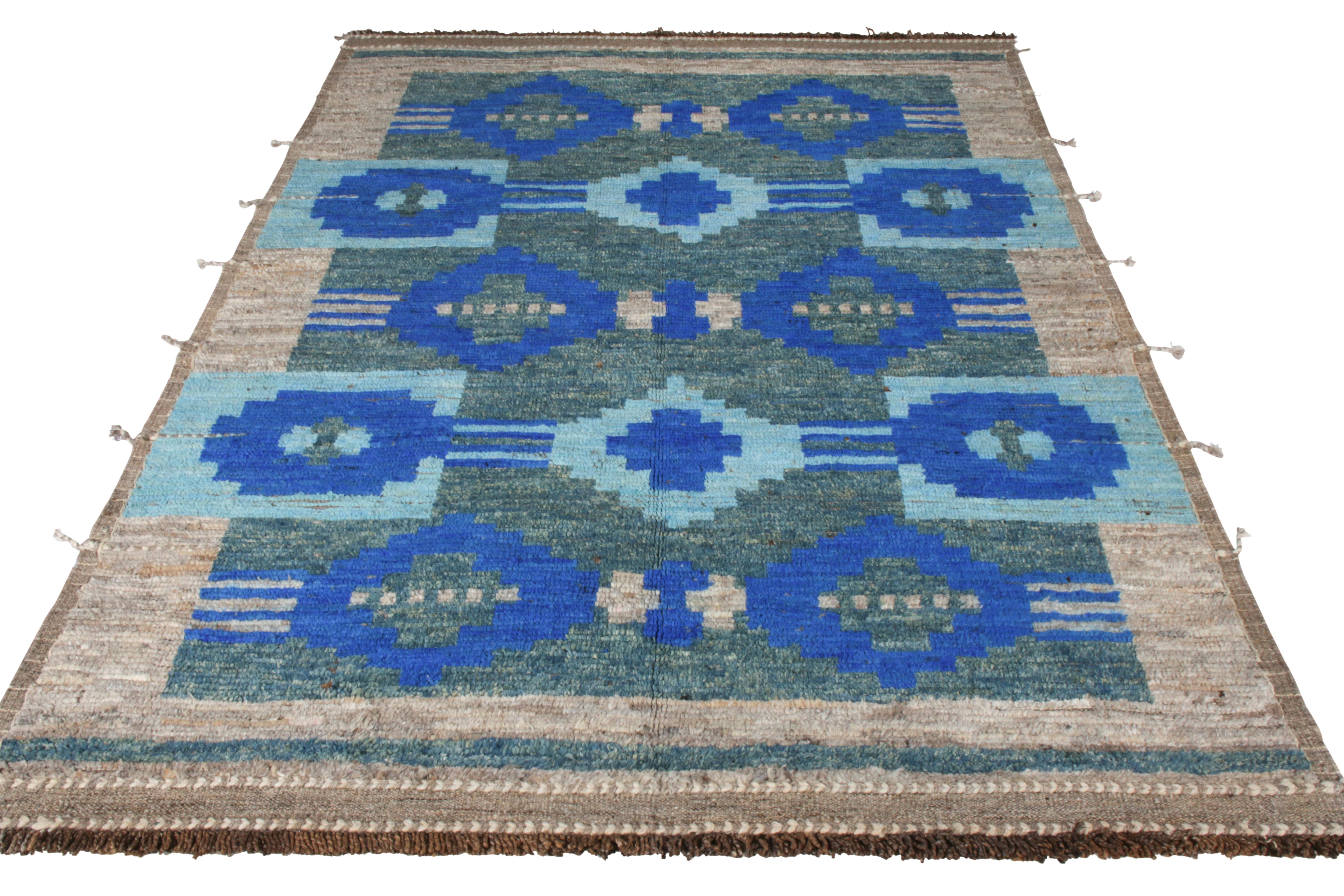 Hailing from Rug & Kilim’s New & Modern collection, a 6x9 piece displaying an interesting blend of texture and color in this size. Hand knotted in wool, the drawing features an all over geometric pattern in striking shades of blue playing joyfully
