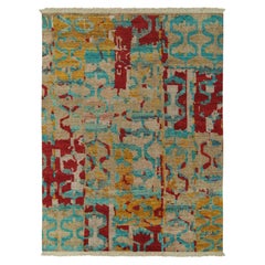 Tappeto moderno Rug & Kilim con motivi astratti blu, rossi e oro