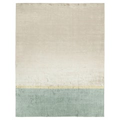 Rug & Kilim’s Modern Rug in Blue with Gold Stripe and Beige Geometric Pattern