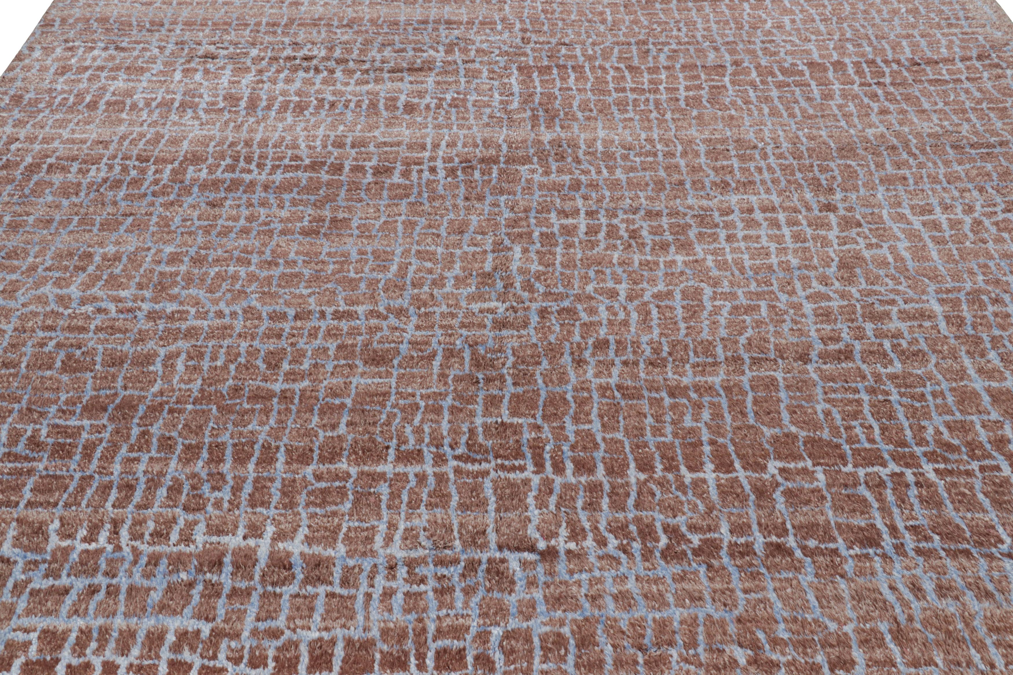 Made with a luxurious, textural silk, this 9x12 contemporary rug is an exciting new unveiling from the Modern Collection by Rug & Kilim. 

On the Design:

This particular piece enjoys brown tones underscoring a geometric pattern in ice and sky blue