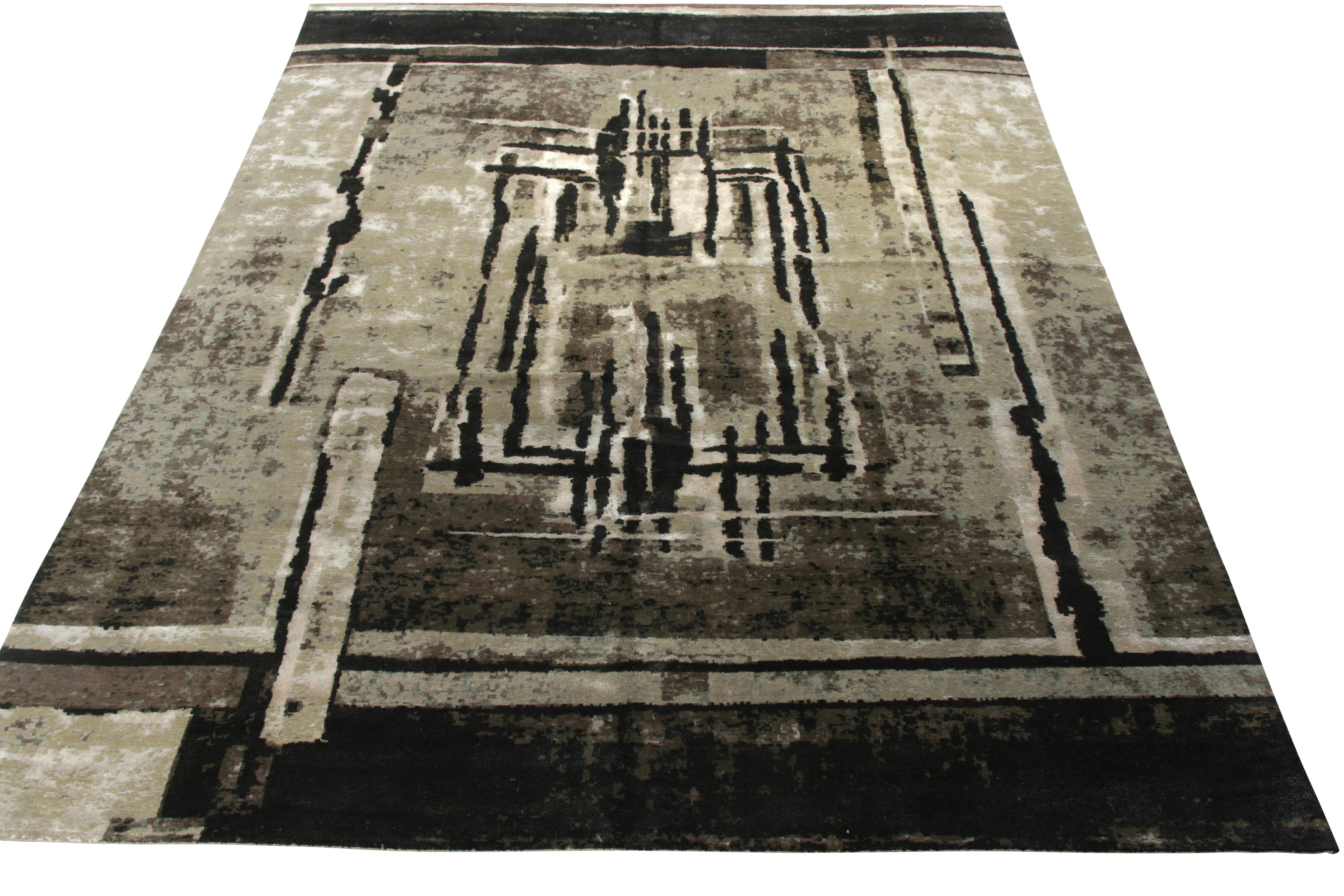Hand knotted in a fine blend of wool and silk, this 11x14 modern rug hails from Rug & Kilim’s Deco-inspired collection. Bearing an intricate geometric pattern, the piece plays positive negative in shades of gray-silver with notes of white, black,