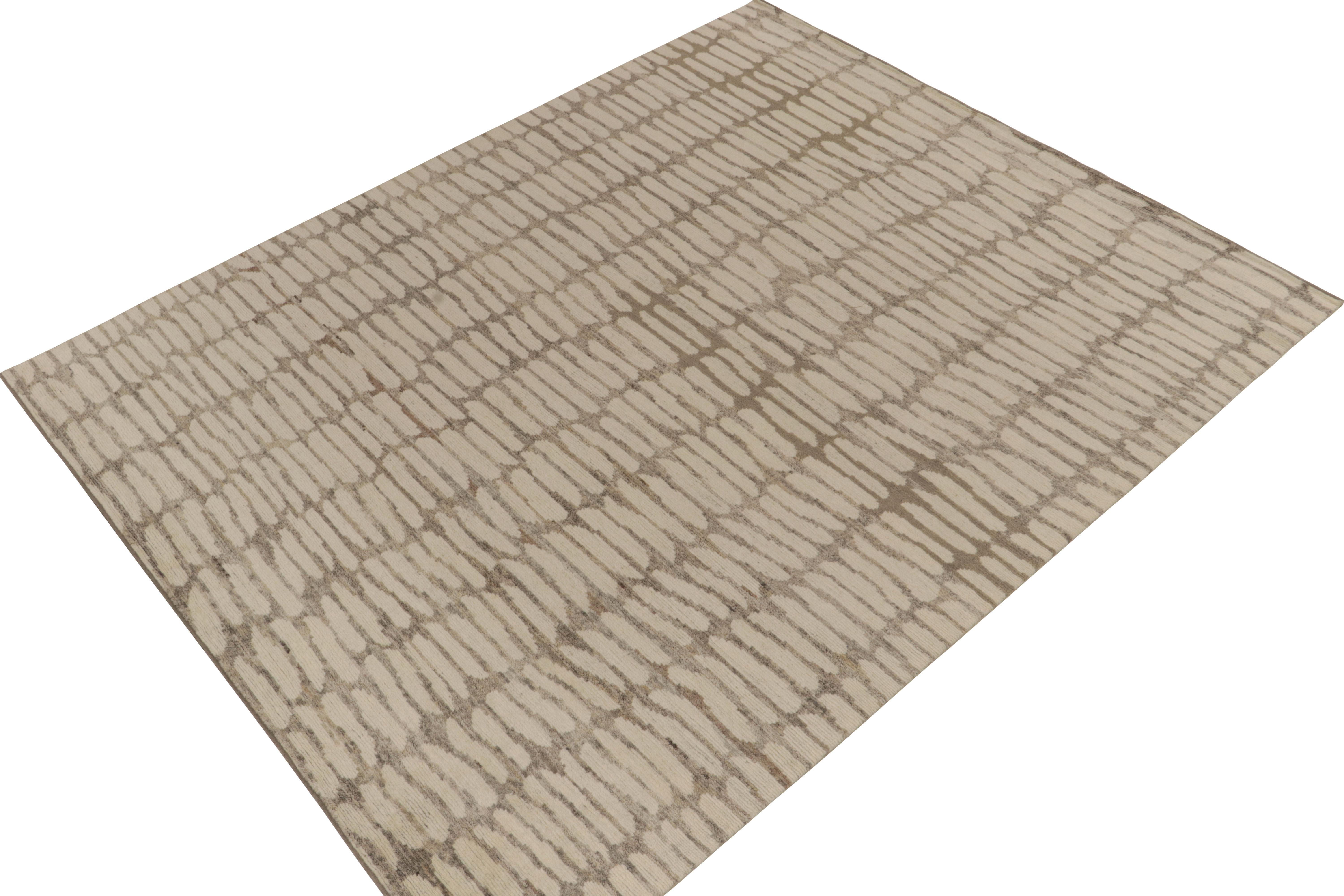 From Rug & Kilim’s bold New & Modern selections, an 8x10 rug hand-knotted in all wool. 

On the Design: The piece is a subtle nod to abstract aesthetics with sensible layering of white oval patterns atop gray with beige notes. Keen eyes will admire
