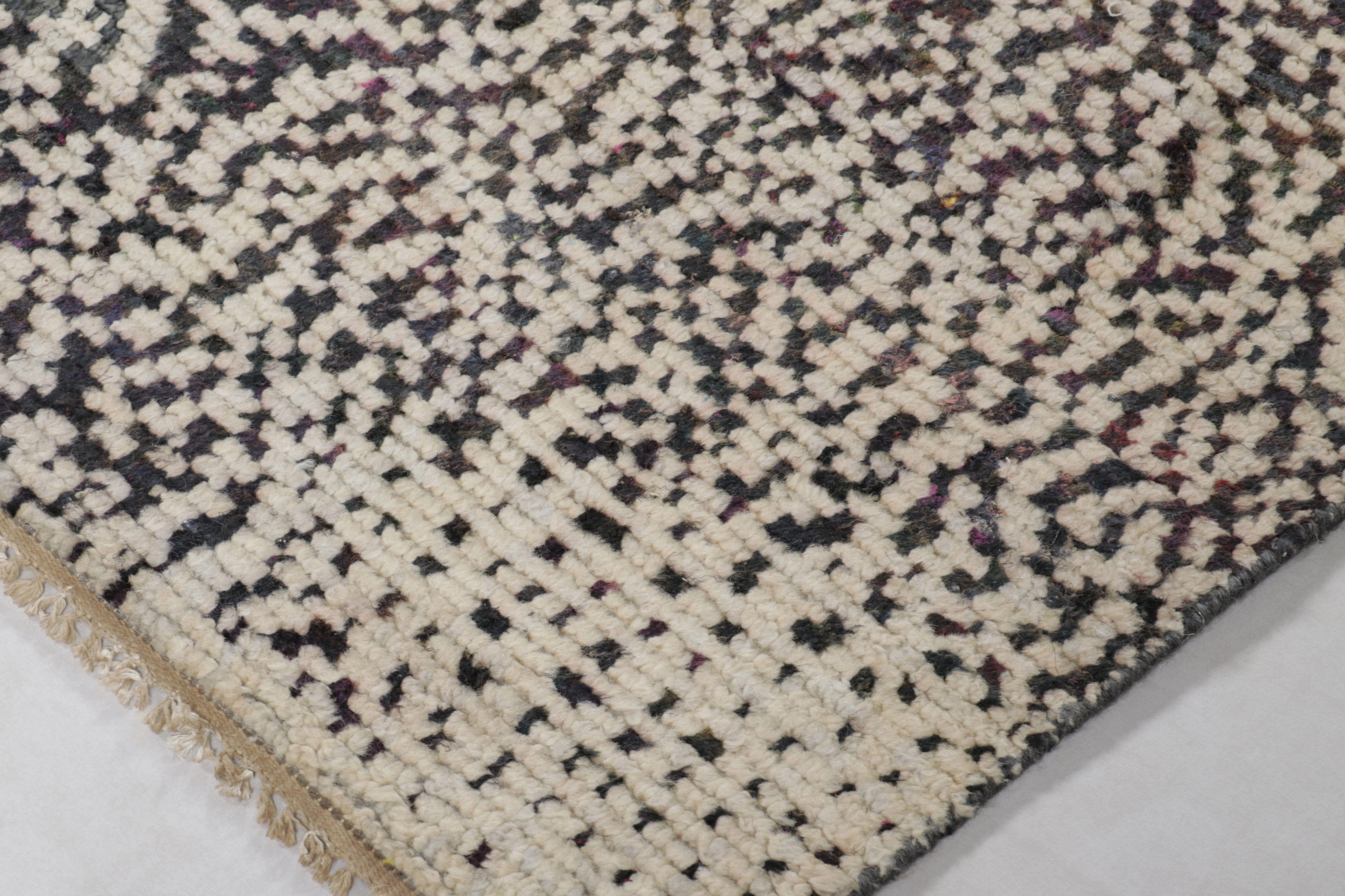 This magnificent 8x10 rug from Rug & Kilim’s Modern Collection is a graphic, textural work of art, hand-knotted in a rich new wool and silk blend. The design features a dense, all-over flickering dot pattern in a dramatic monochrome of black,