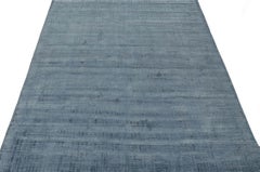 Rug & Kilim’s Modern Rug in Solid Blue Tone-on-tone Striae