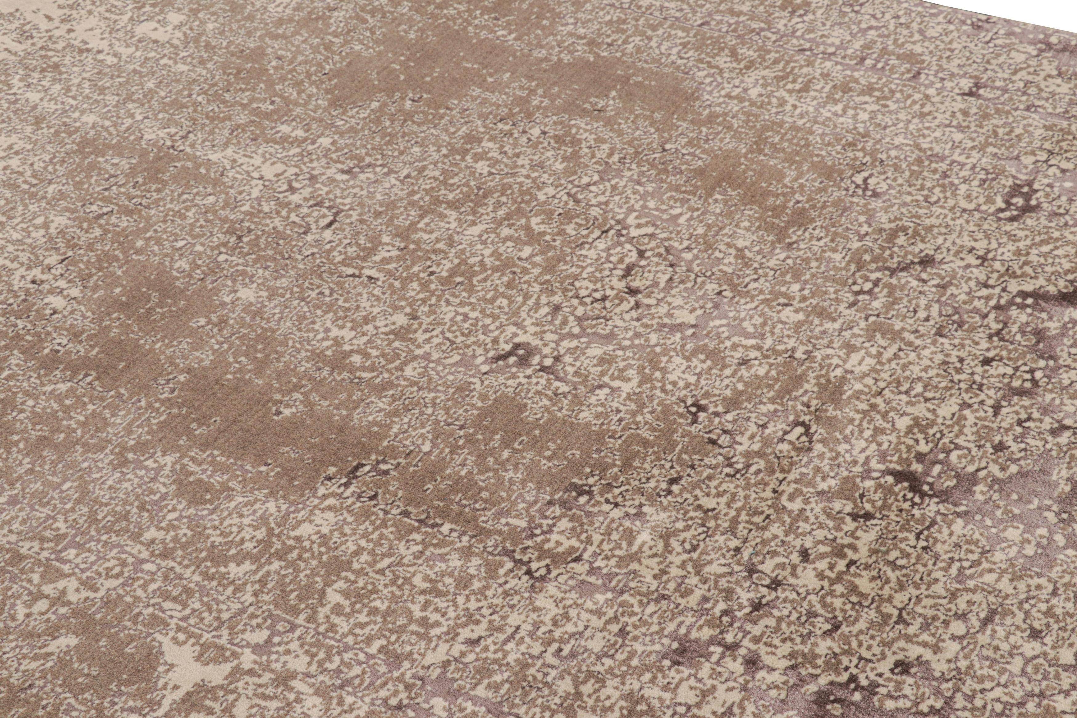 Hand-knotted in wool, this 6x10 modern rug by Rug & Kilim enjoys an abstract design with a subtle inspiration from antique and vintage rug patterns.

On the Design: 

A play of creamy beige-brown, mauve purple, and taupe gray tones underscores the