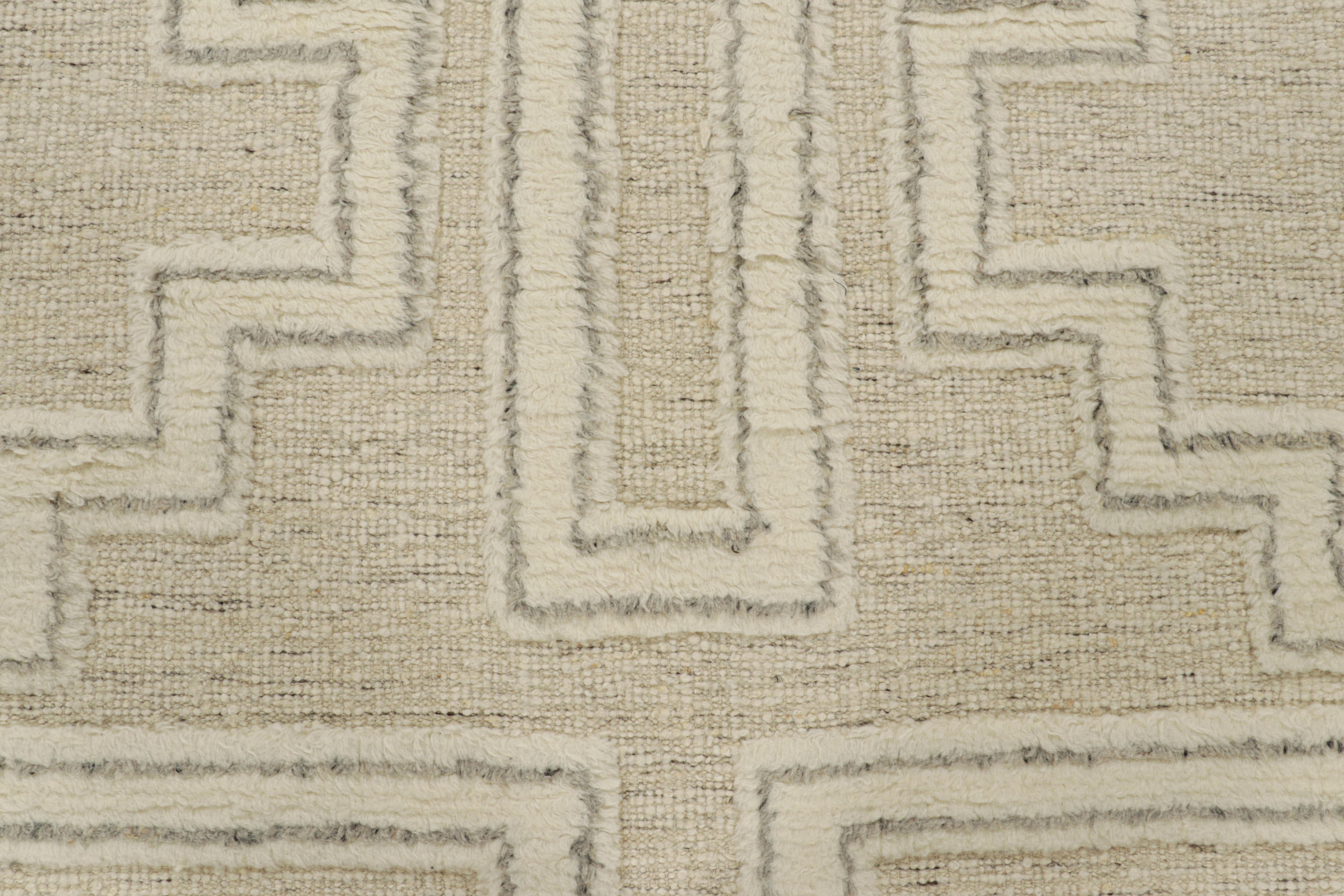 Hand-knotted in wool, this 8x10 smart work both contemporary and textural from India, features variations in color and pile height which lend a fabulous sense of dimension to the geometric patterns in creamy off-white tones. 

On the Design: