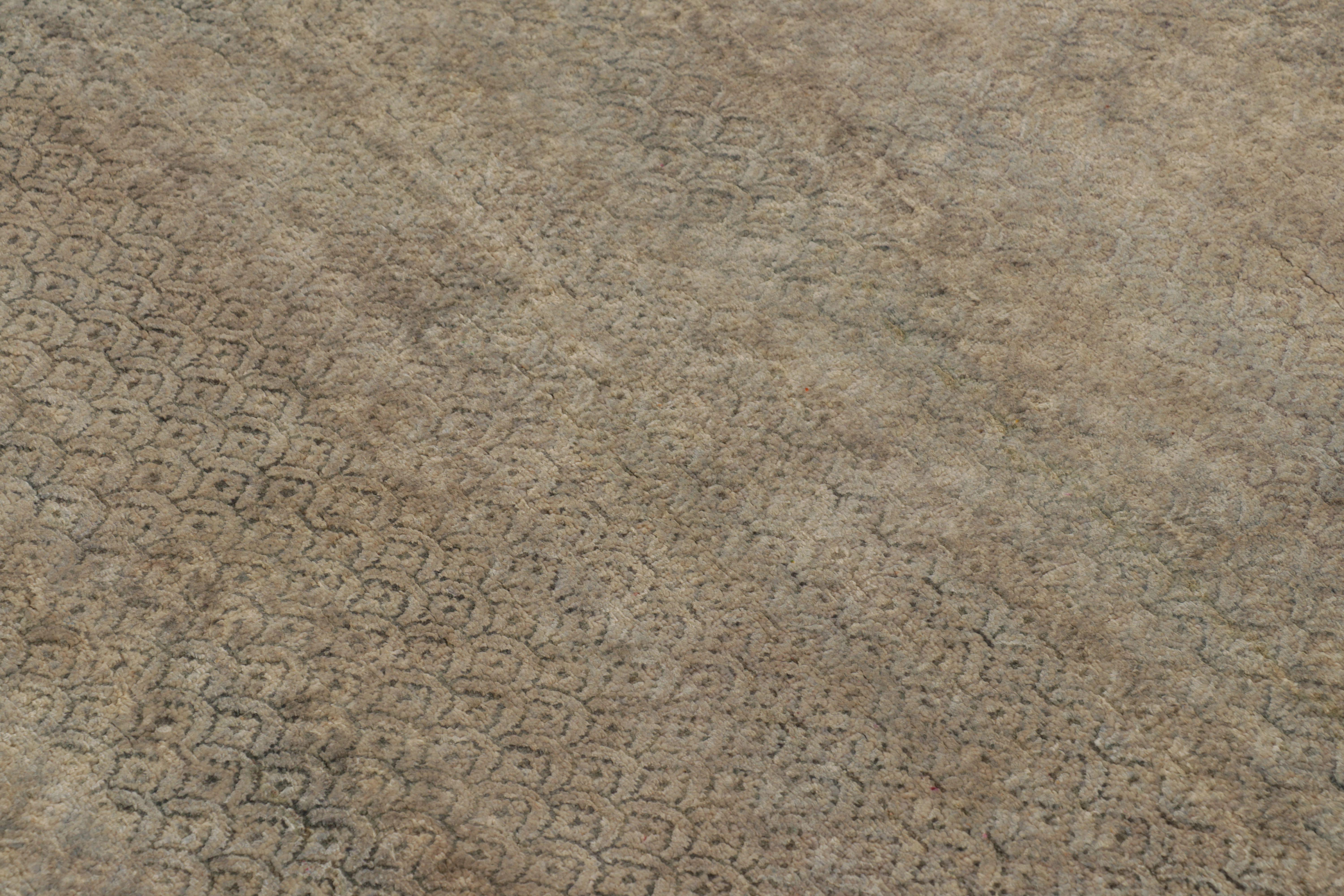 This magnificent 3x10 Minimalist Runner rug from Rug & Kilim’s Modern Collection is a textural work of art, hand-knotted in a blend of wool and silk. The design features a seamless, tonal field of taupe and mocha, subtly overlaid with a ghosted
