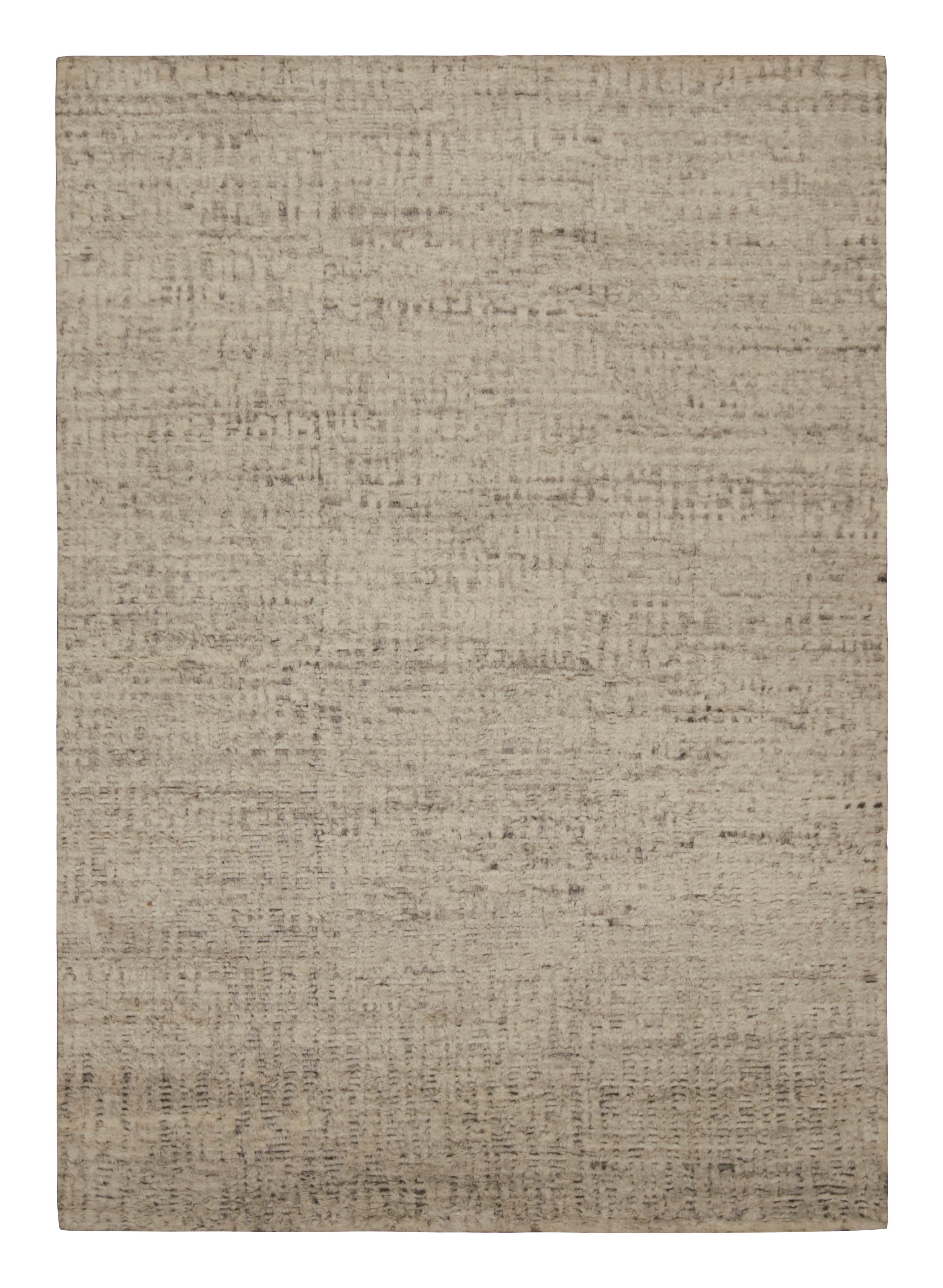Dieser handgeknüpfte Wollteppich im Format 10x14 mit modernem Hochflor in den Farben Beige und Braun zeichnet sich durch sein schlichtes Design aus, ist aber so außergewöhnlich, dass er überall bequem Platz findet. 

Über das Design:

 Mit seiner