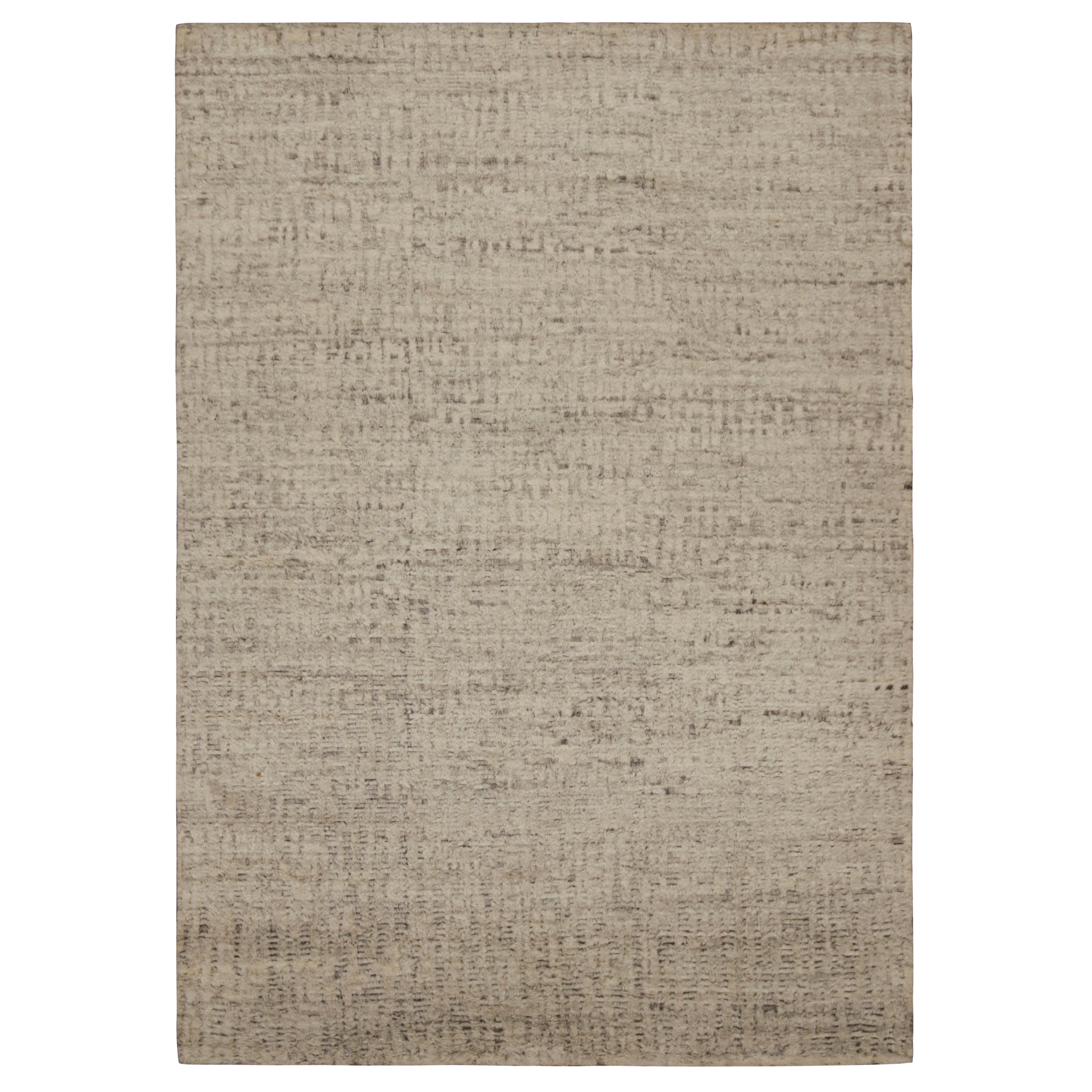 Hand-knotted in wool, this 10x14 modern textural high-pile rug in beige and brown, features a simple design, but extraordinary in its essence to sit comfortably anywhere. 

On the design:

 Embracing simplicity while exuding extraordinary essence,